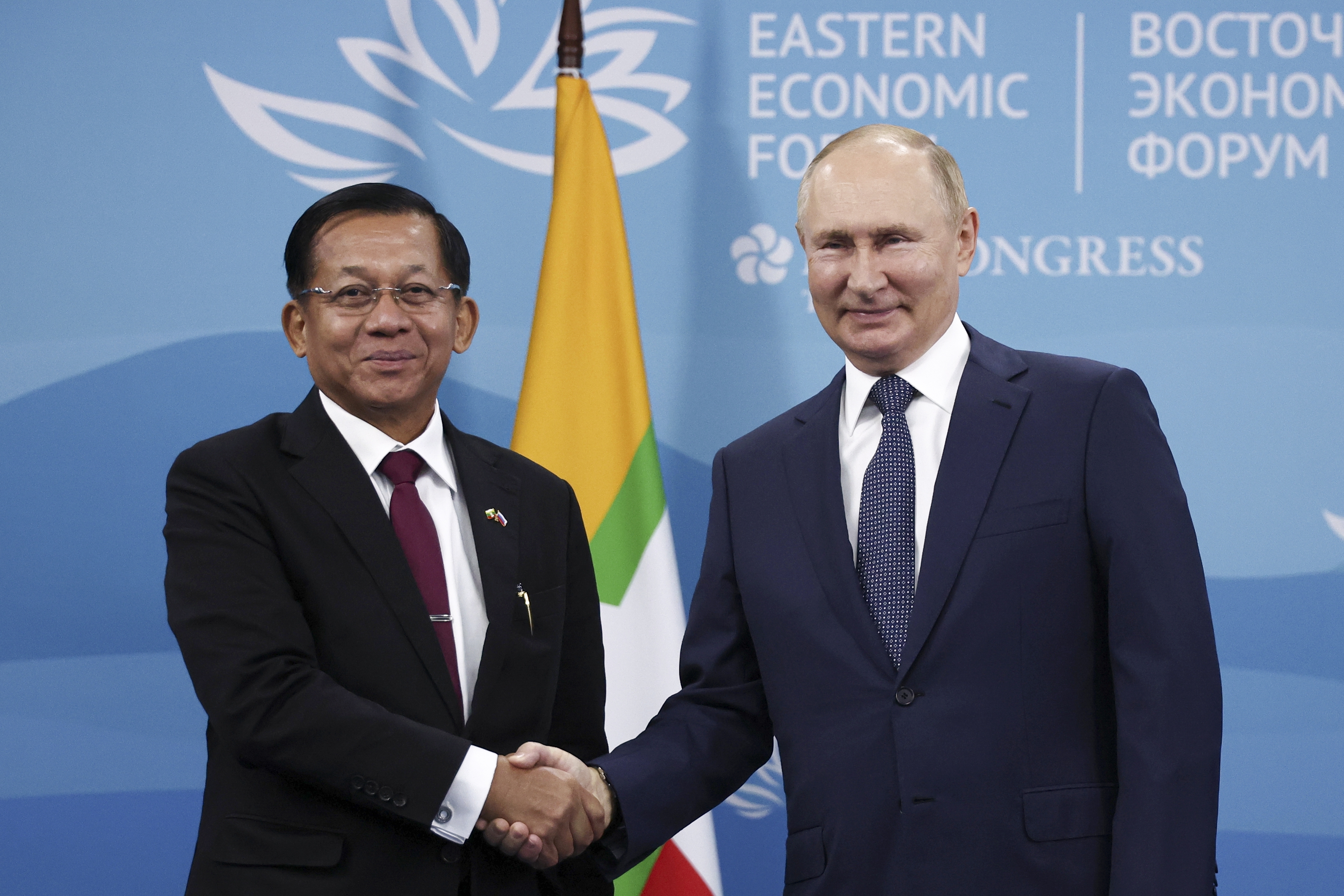 Russian President Vladimir Putin and Myanmar Senior General Min Aung Hlaing shake hands and pose for a photo during their meeting on the sideline of the Eastern Economic Forum in Vladivostok, Russia.