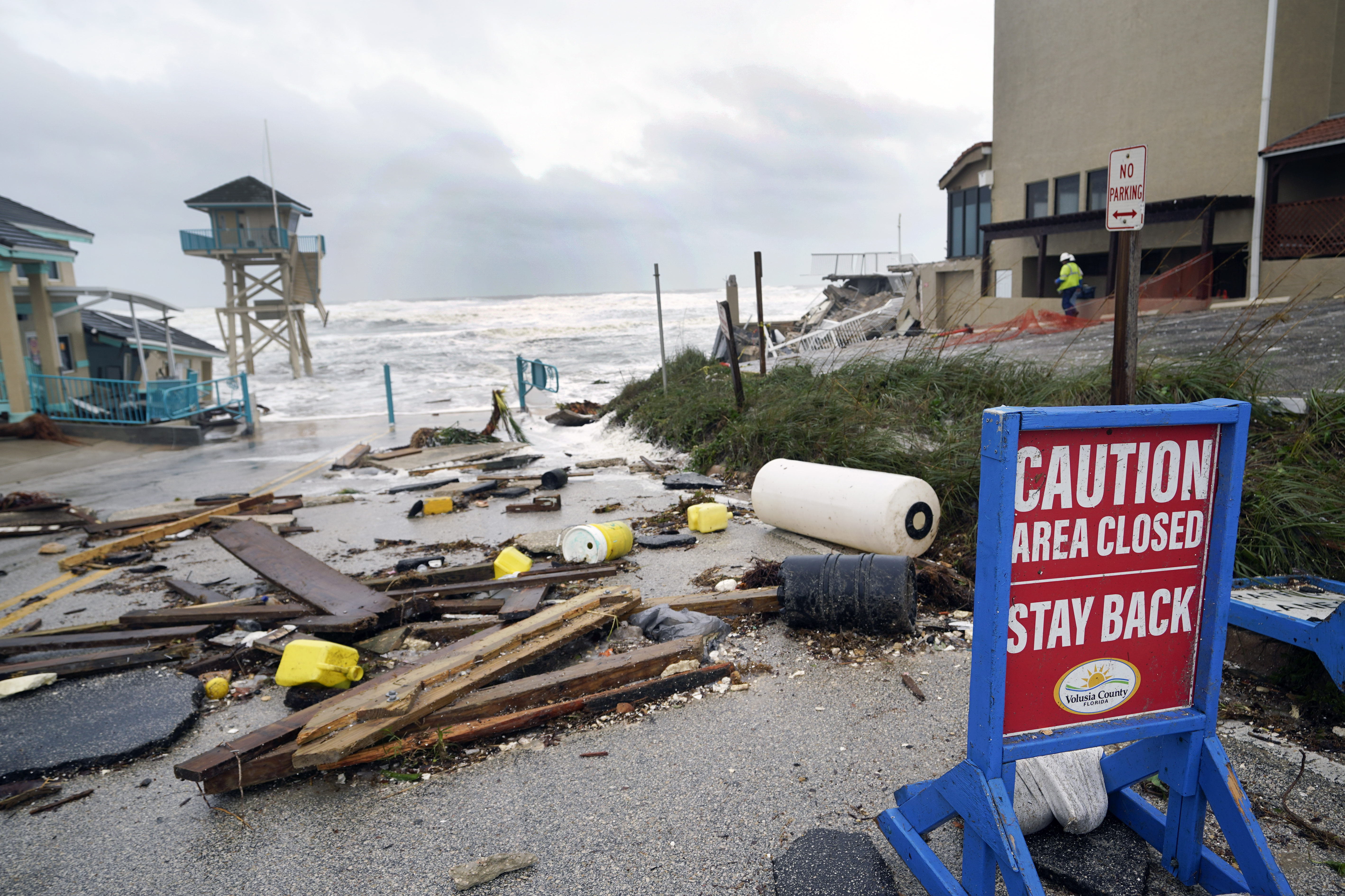 A public facility and life guard tower are seen partially collapsed near the Pirates Cove condominium due to an Atlantic Ocean storm surge by Hurricane Nicole Thursday, in Daytona Beach Shores, Florida.