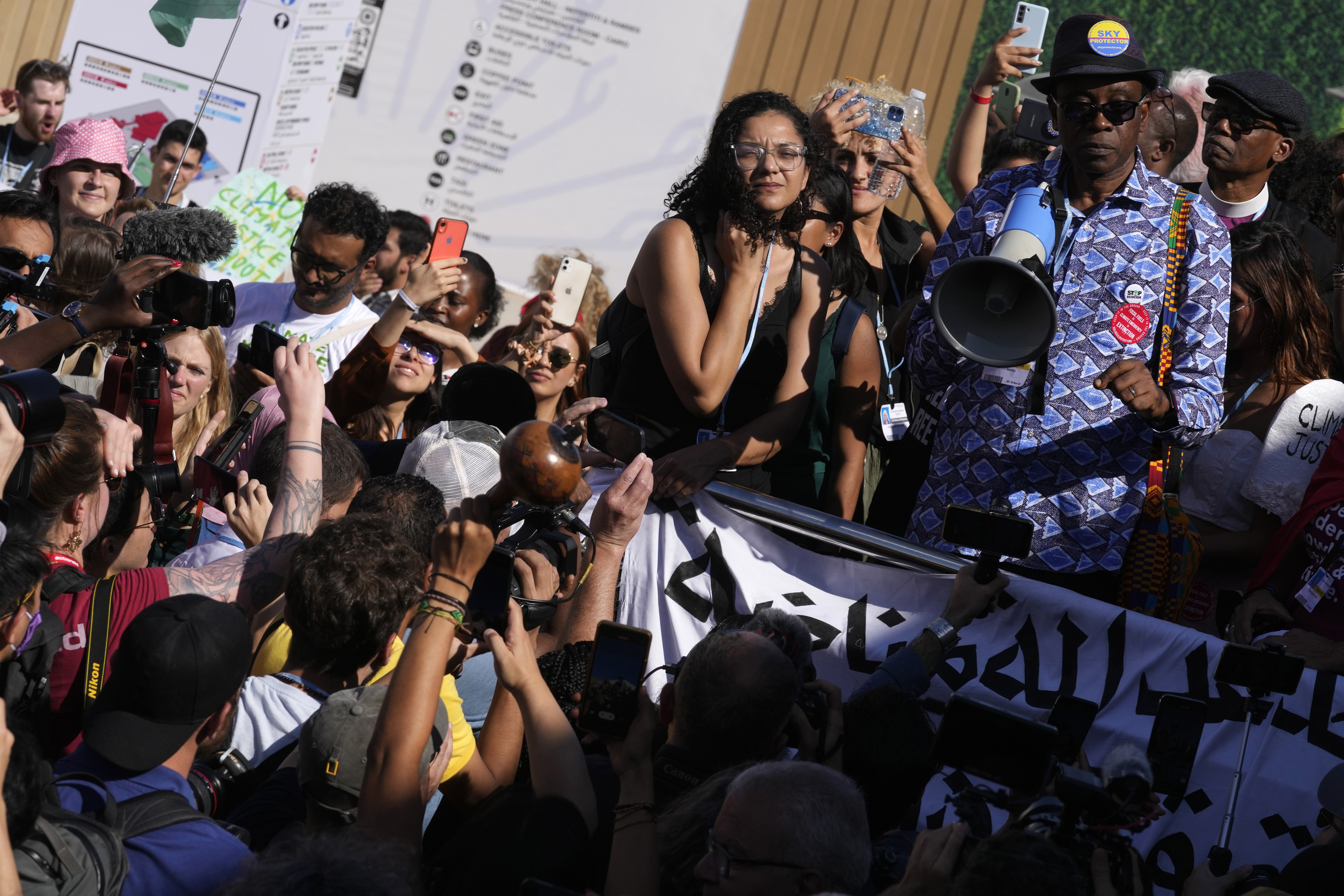 Sanaa Seif, center, sister of Egypt's jailed leading pro-democracy activist Alaa Abdel-Fattah, attends a protest at the COP27 U.N. Climate Summit.