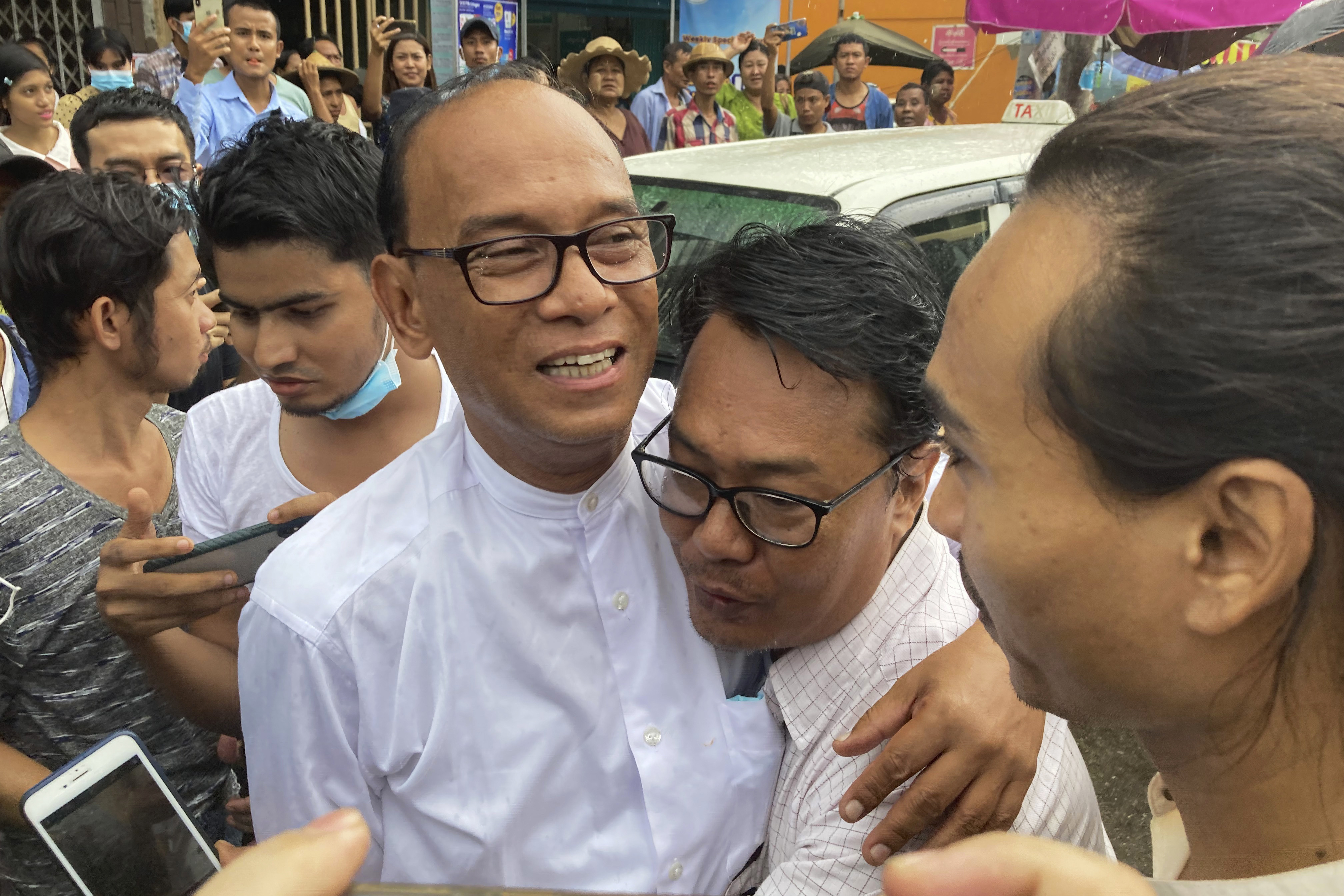 Some political prisoners were among the nearly 6,000 people released. Mya Aye (centre), a prominent leader from Myanmar’s 88 Generation Students Group, was among those freed [AP Photo]