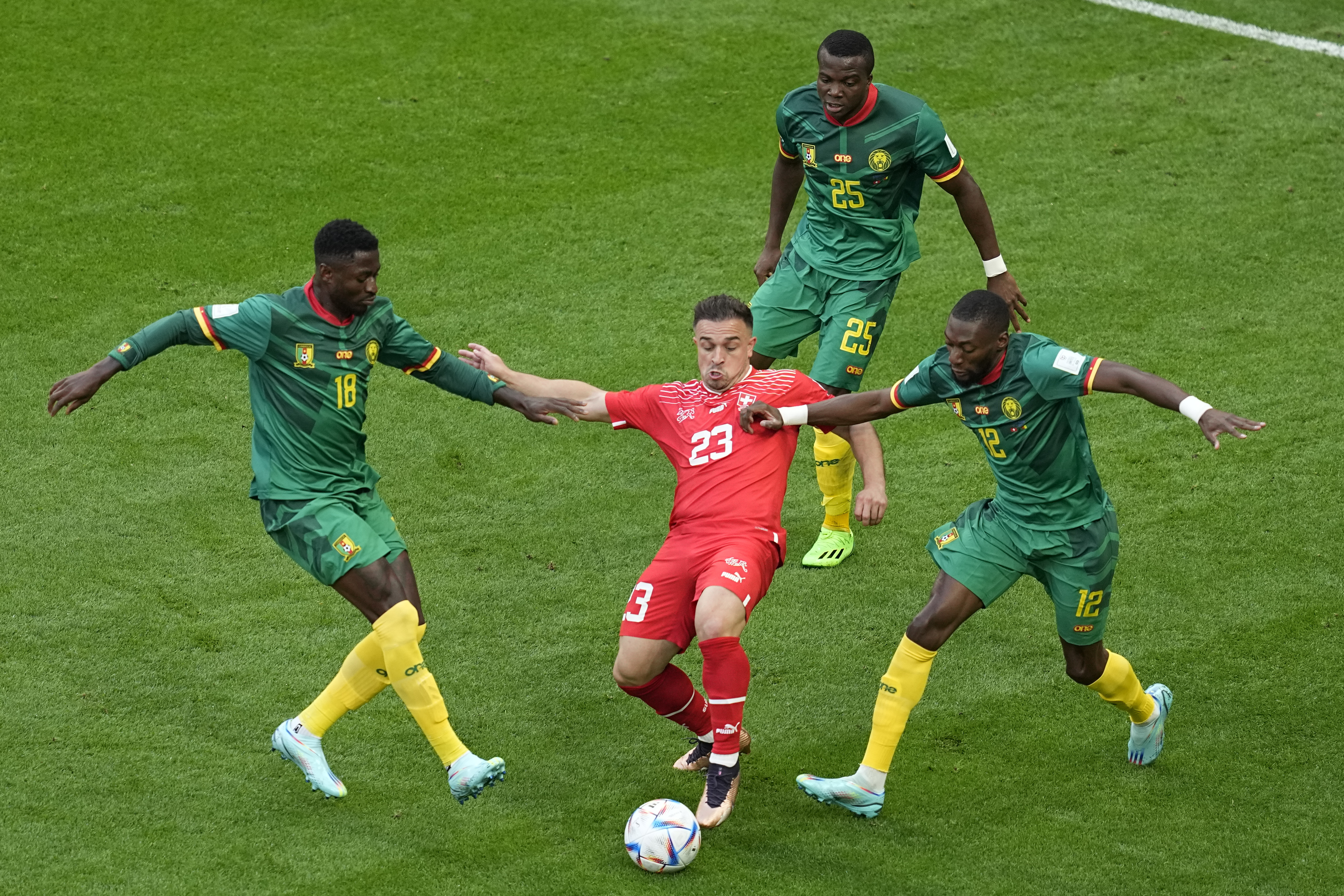 Cameroonian players intercept Switzerland’s Xherdan Shaqiri (centre) during a World Cup group G match at Al Janoub Stadium in Al Wakrah, Qatar, on November 24, 2022