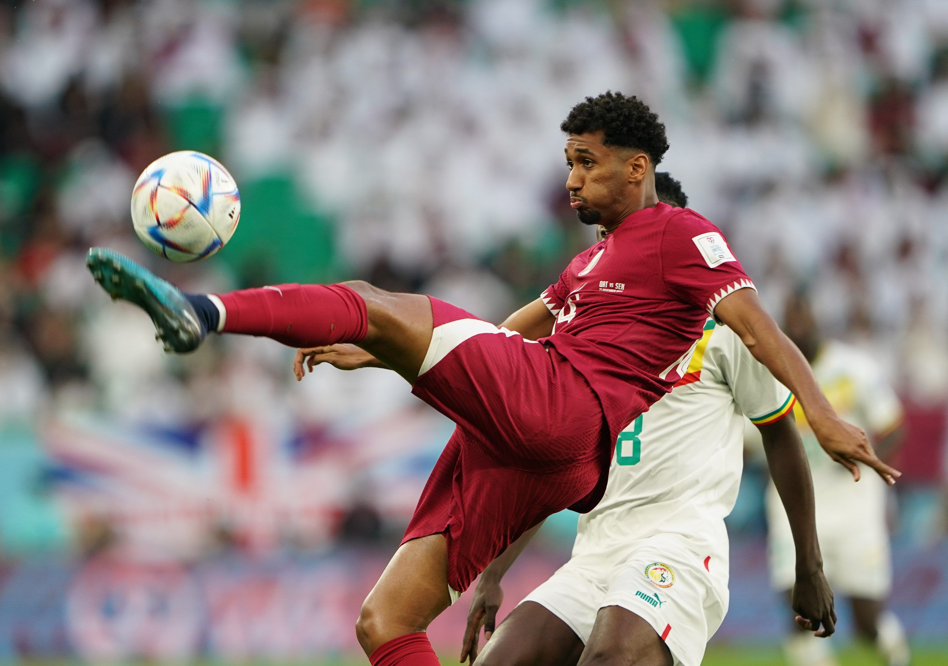 Qatar’s Homam Ahmed in action during Qatar v Senegal match at Al Thumama Stadium in Doha, Qatar