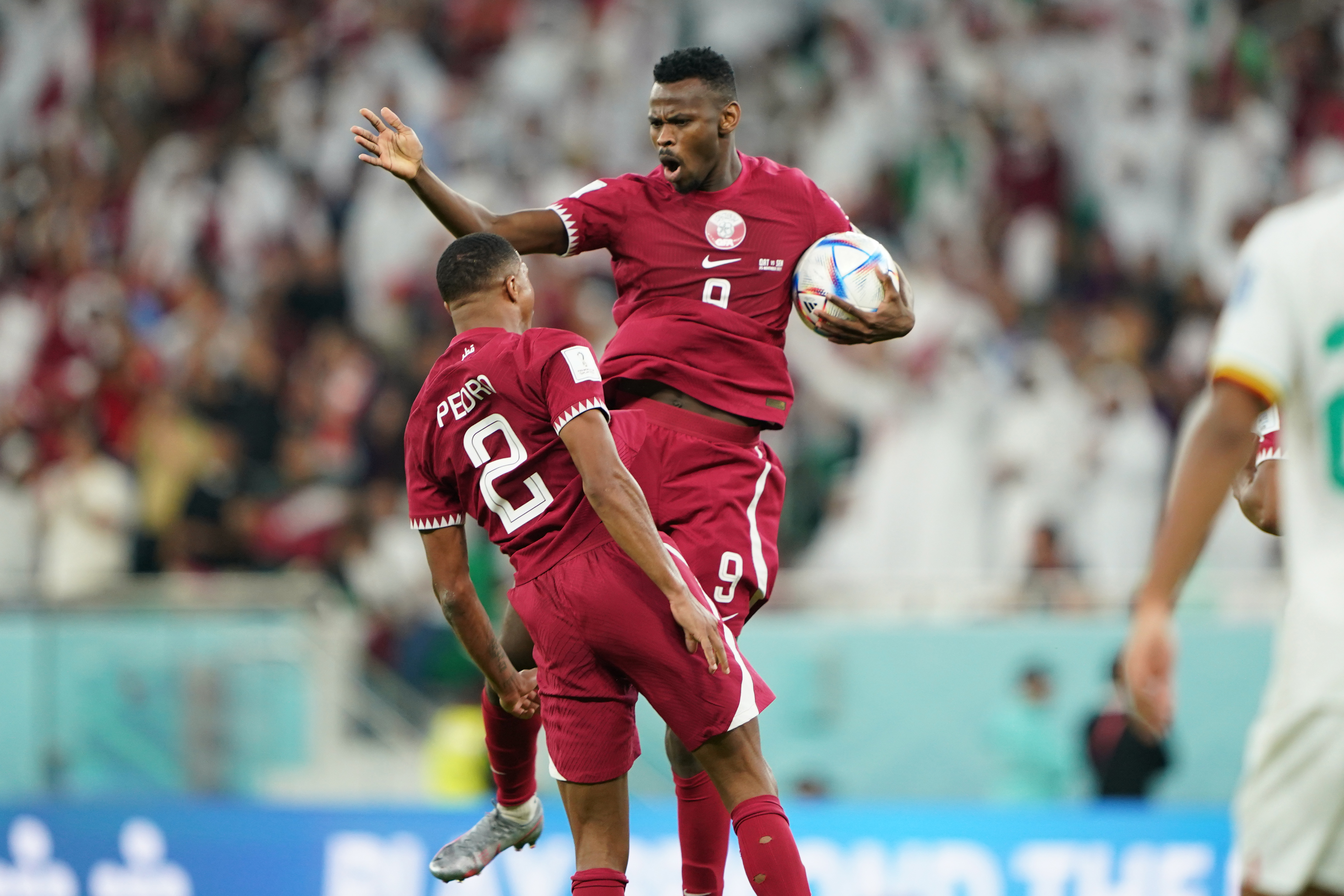 Qatar’s Mohammed Muntari (right) celebrates with Pedro Miguel after scoring their team’s first goal in the Qatar vs Senegal, Group A, FIFA World Cup match on November 25, 2022, at Al Thumama Stadium in Doha, Qatar