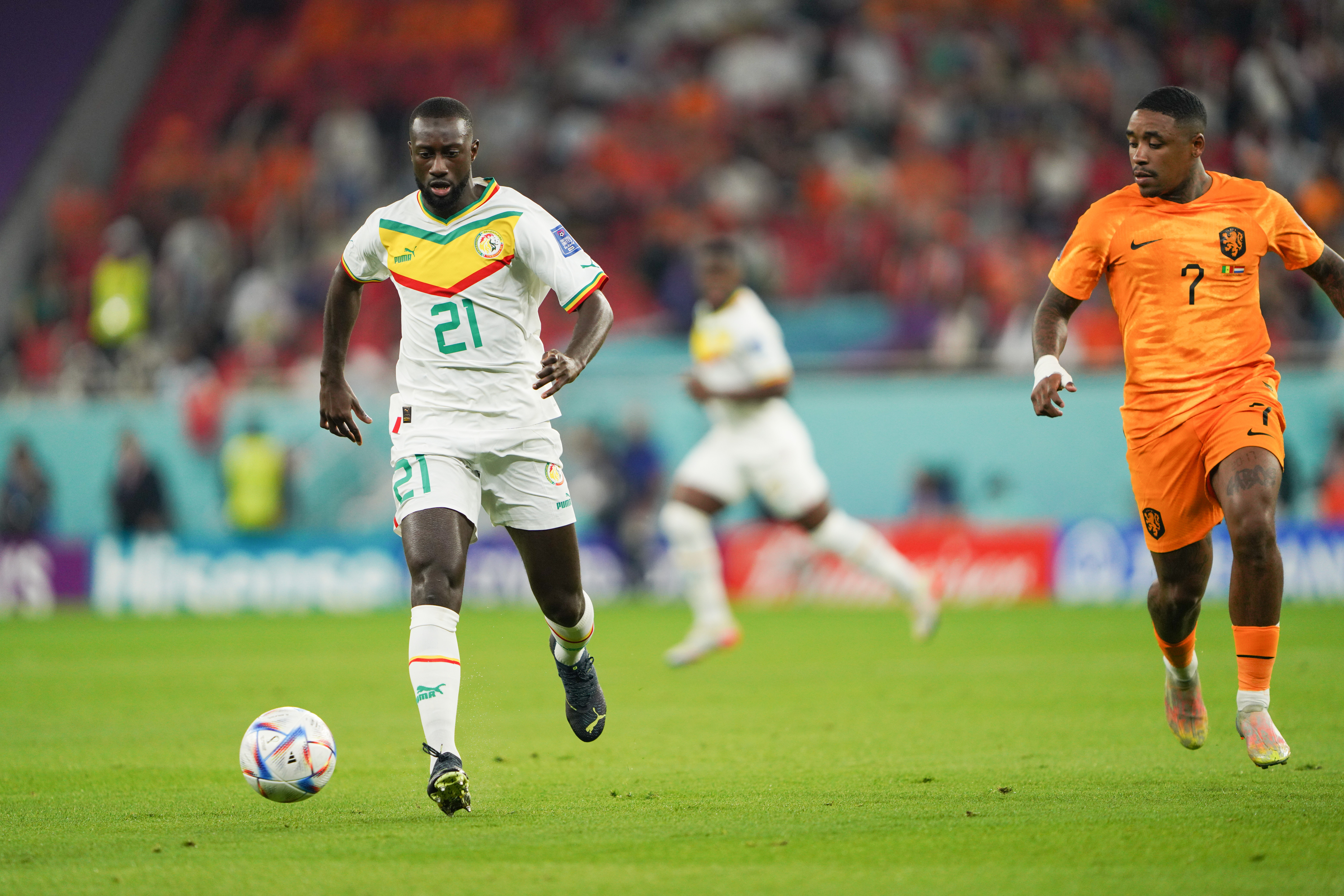 Boulaye Dia (left) of Senegal in action against the Netherlands in their Group A game on November 22, 2022, at Al Thumama Stadium in Doha, Qatar