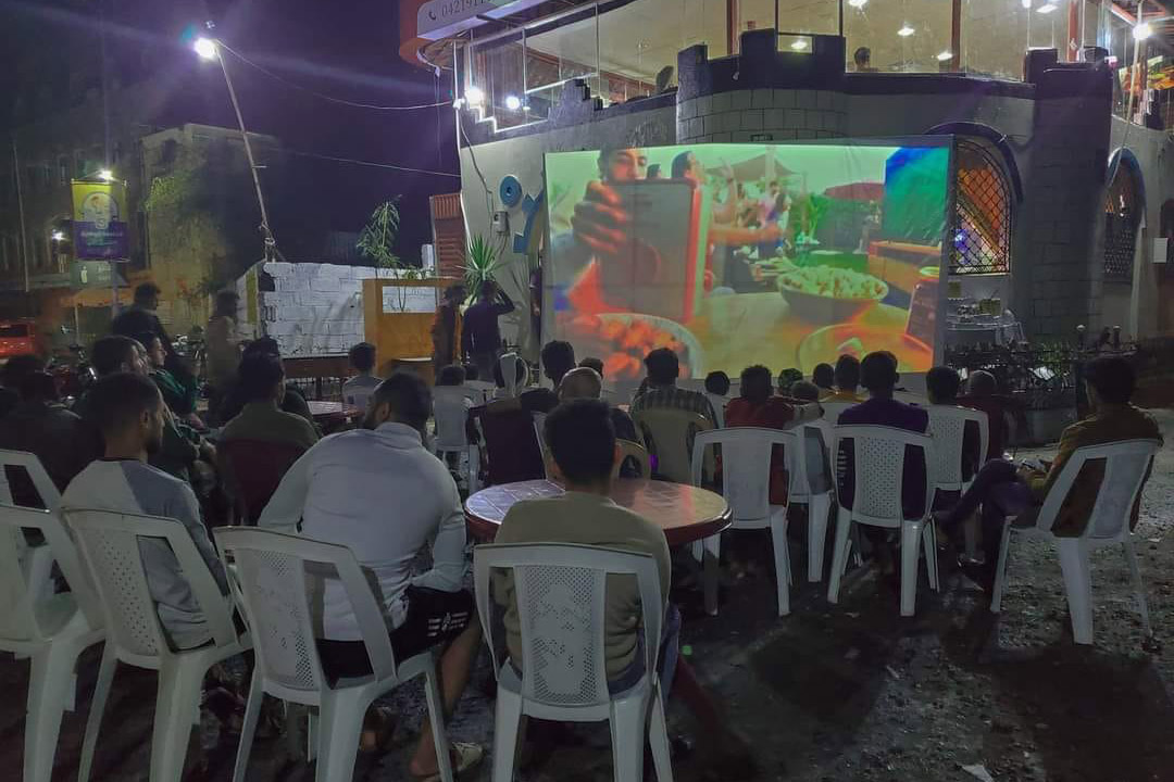 Football fans watch a match in Taiz