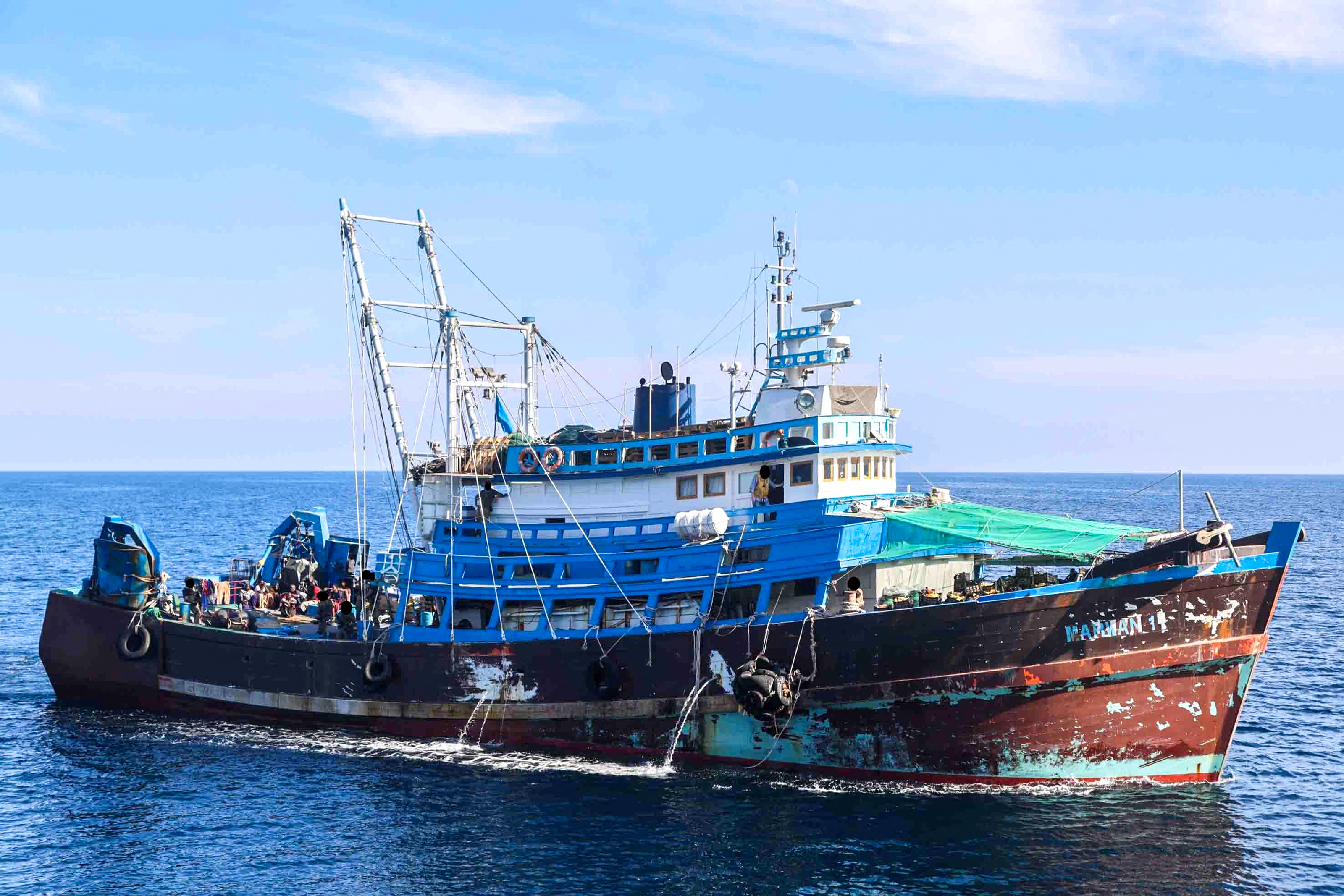 A handout photo released on December 3, 2022, by the US Defence Visual Information Distribution Service shows a fishing trawler reportedly intercepted by the US Navy in the Gulf of Oman [DVIDS via AFP]