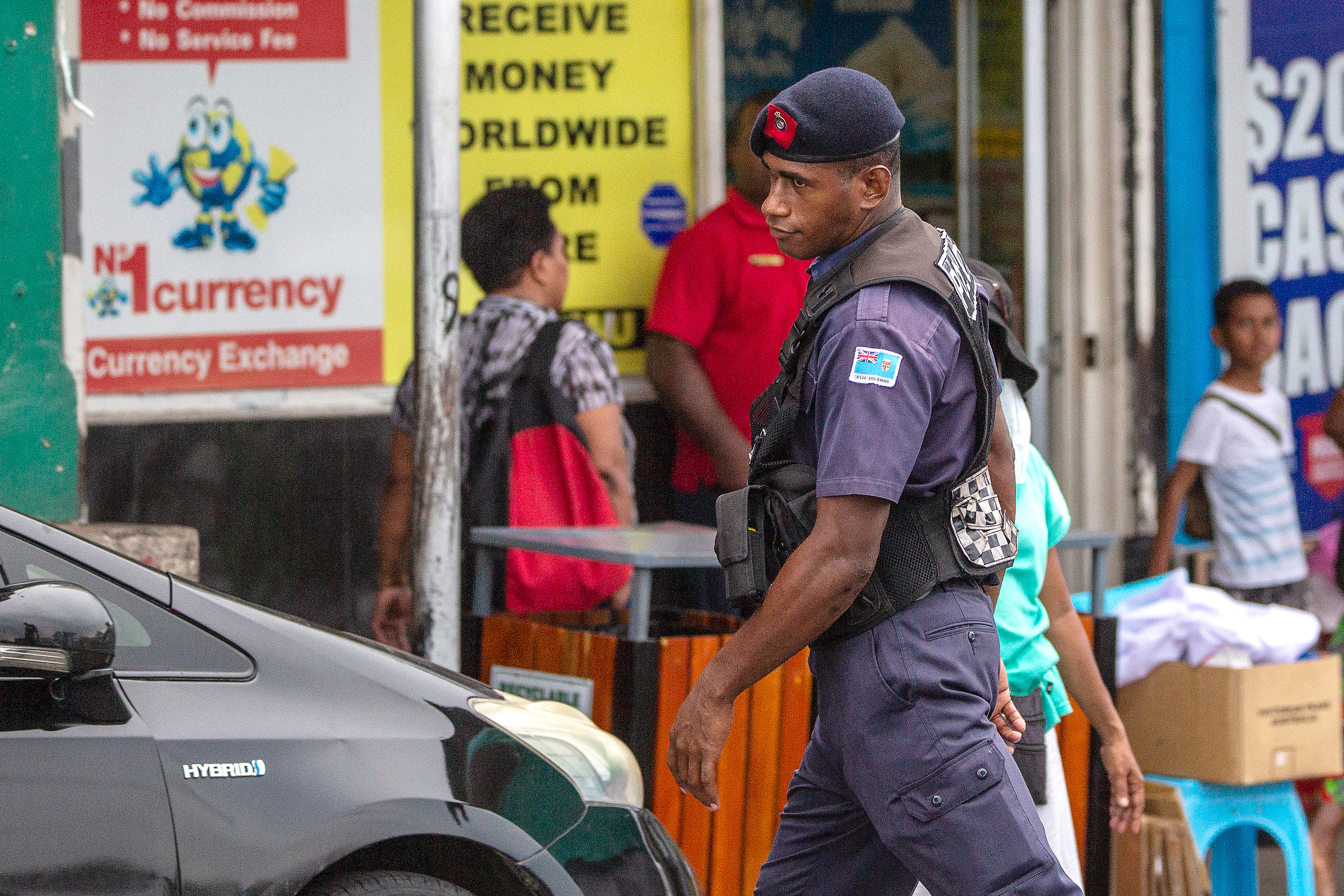 A policeman patrols a street in Fiji's capital Suva on December 22, 2022 [Leon Lord/AFP]