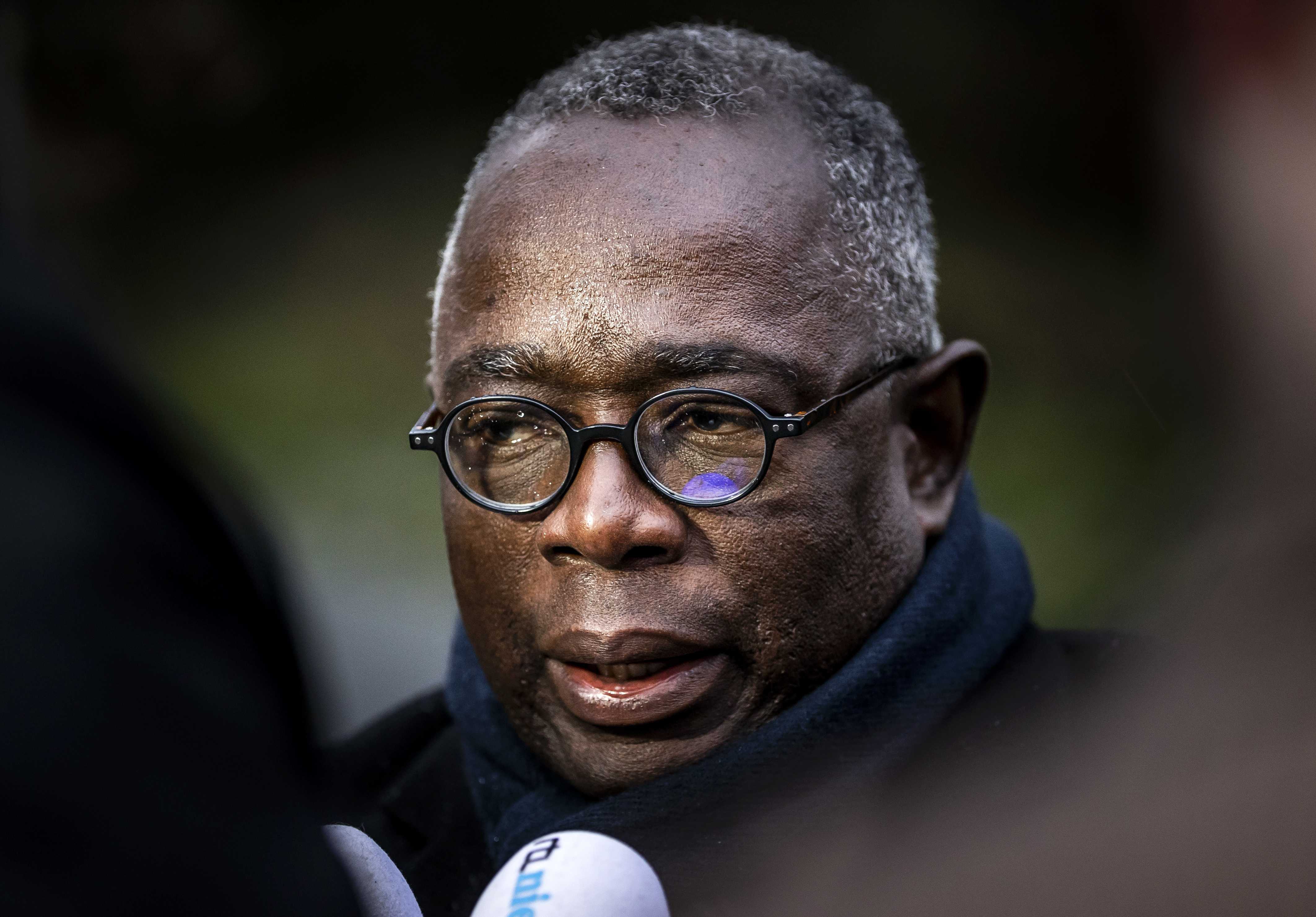 Johan Roozer, of the Suriname National Committee for the Remembrance of Slavery, speaks to reporters