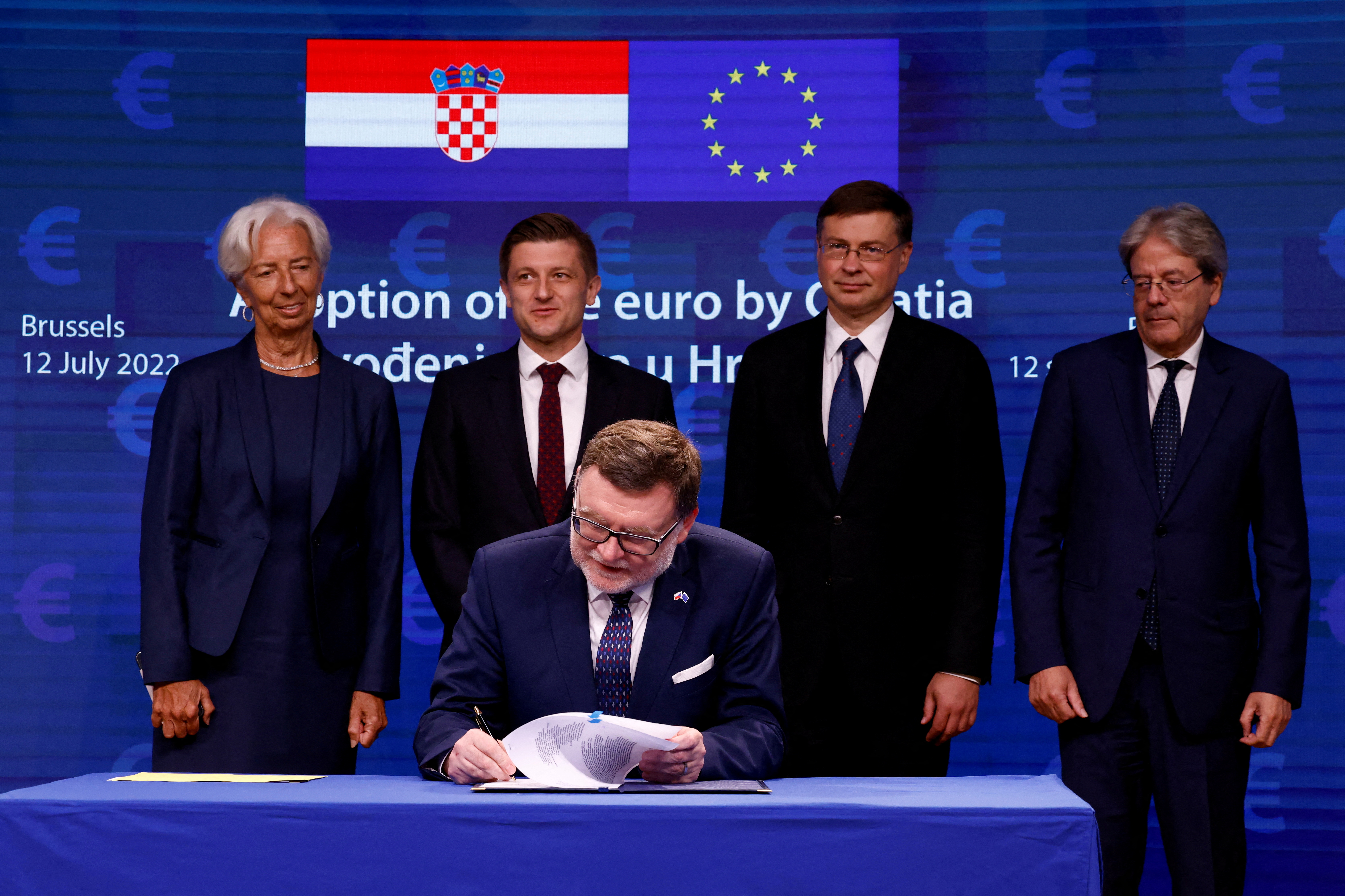 Croatia's Finance Minister Zdravko Maric, European Commissioner vice president Valdis Dombrovskis, President of European Central Bank Christine Lagarde, European Commissioner for Economy Paolo Gentiloni and Czech Finance Minister Zbynek Stanjura take part in a signing ceremony on the adoption of the euro by Croatia in Brussels, Belgium July 12, 2022