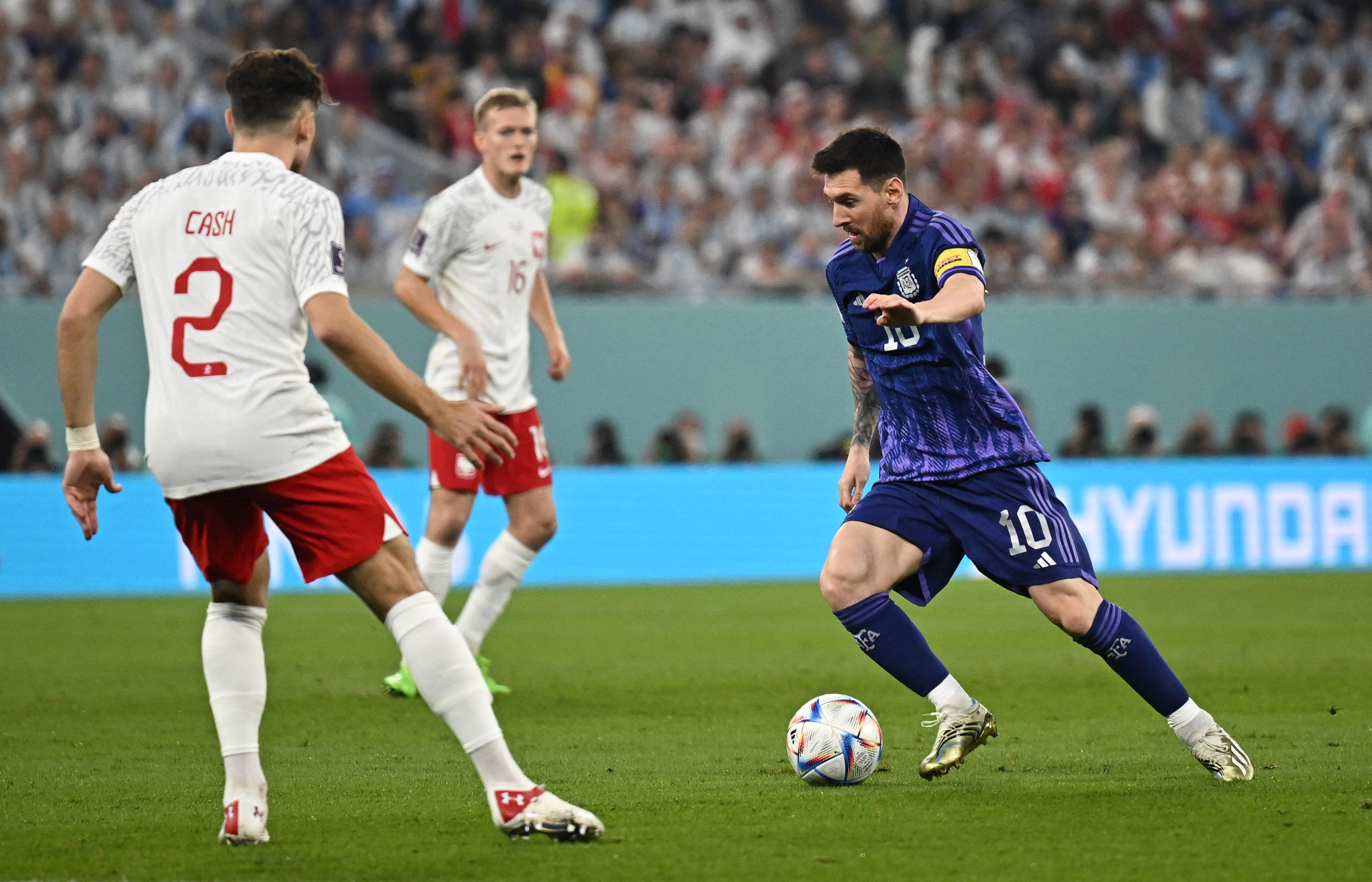 Argentina beat Poland 2-0 to seal the top spot in their group