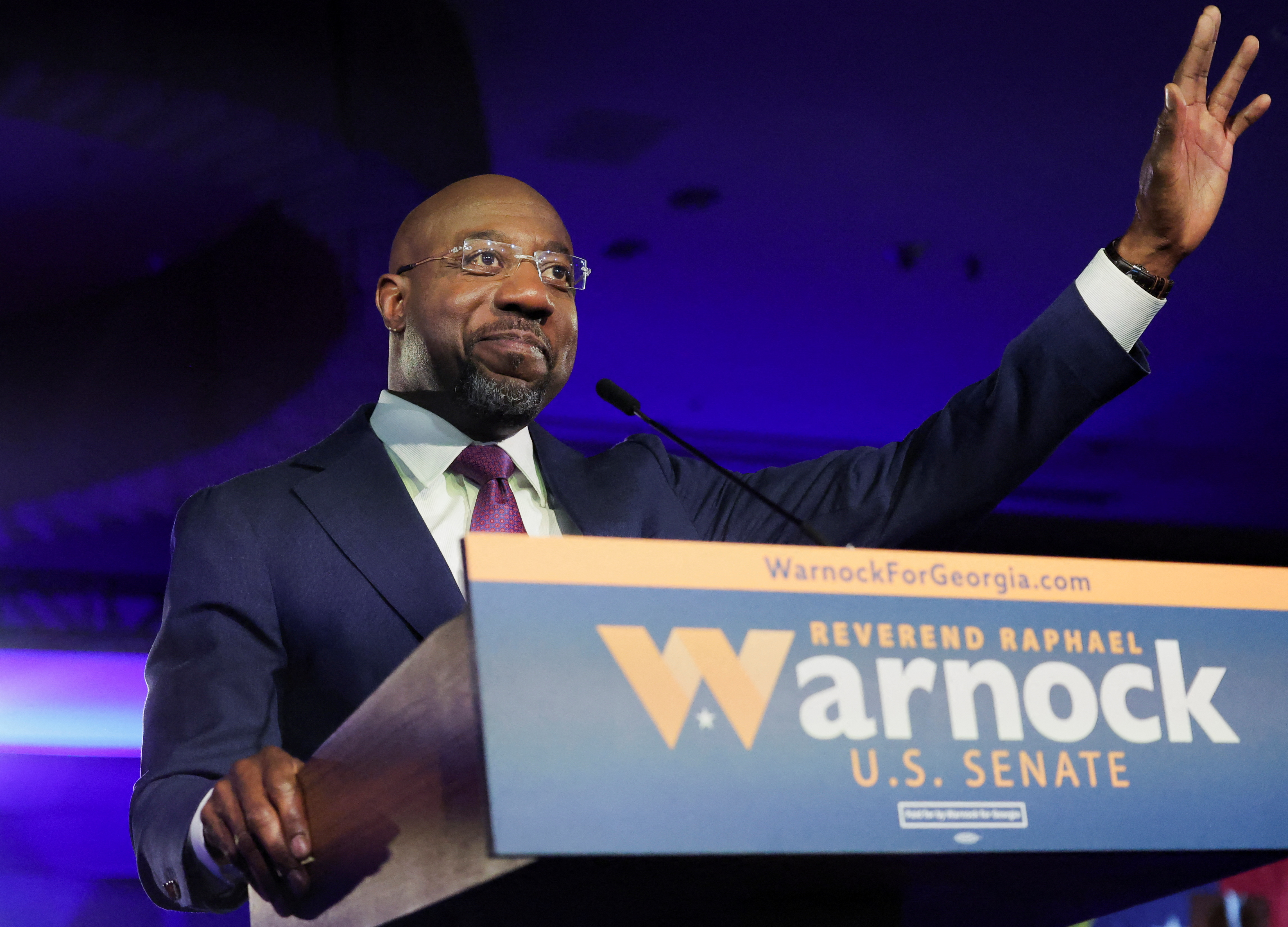 US Senator Raphael Warnock speaks during an election night party in Atlanta, December 6