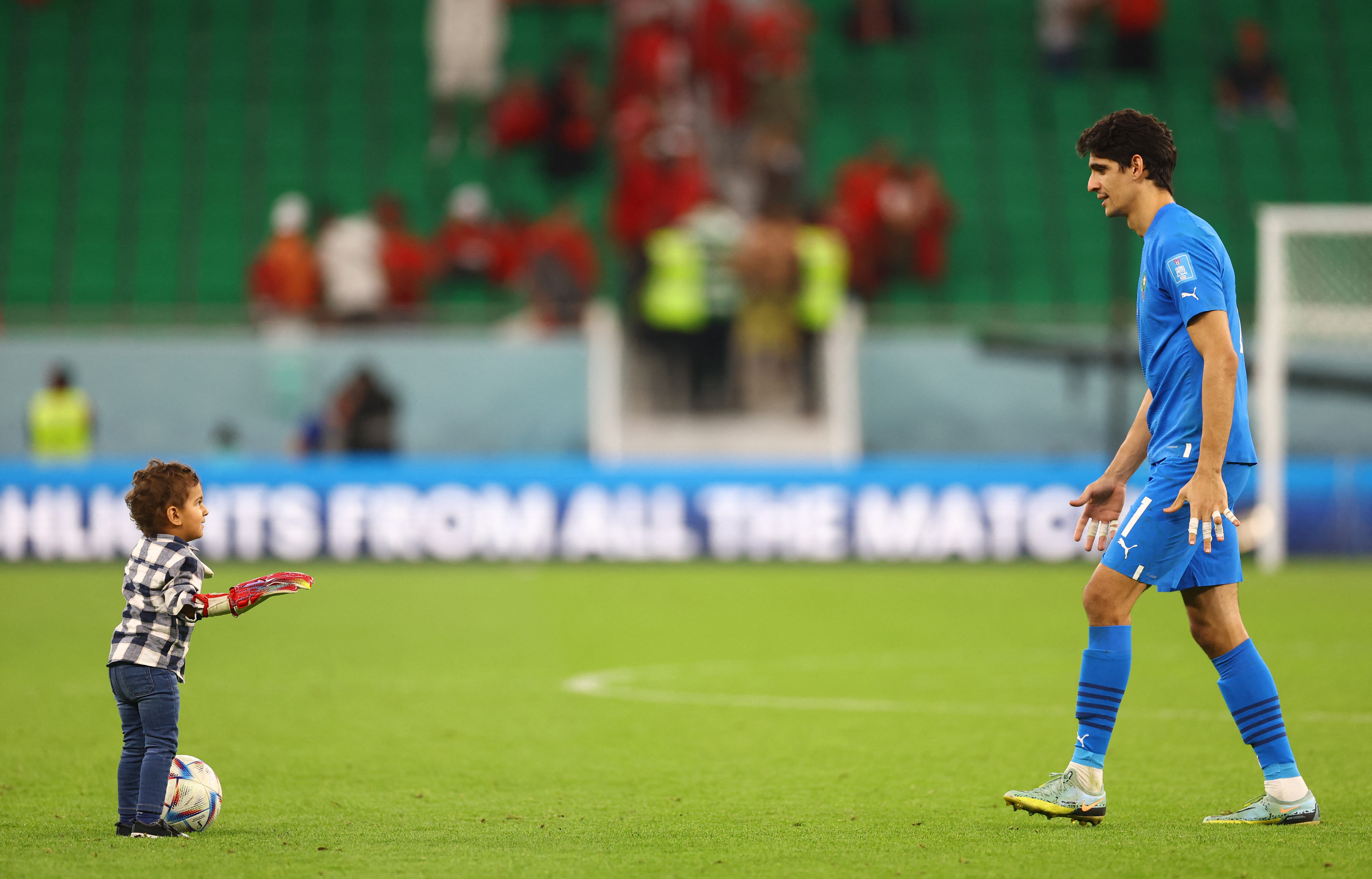 Bounou and his son play together on the pitch after the win over Portugal