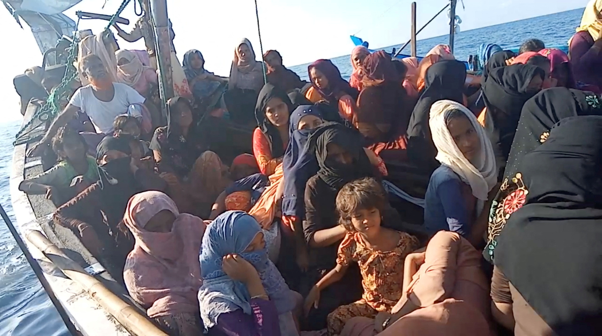 A boat carrying Rohingya refugees, including women and children, is seen stranded in waters off the coast of Bireuen, Aceh province, Indonesia, December 27, 2021