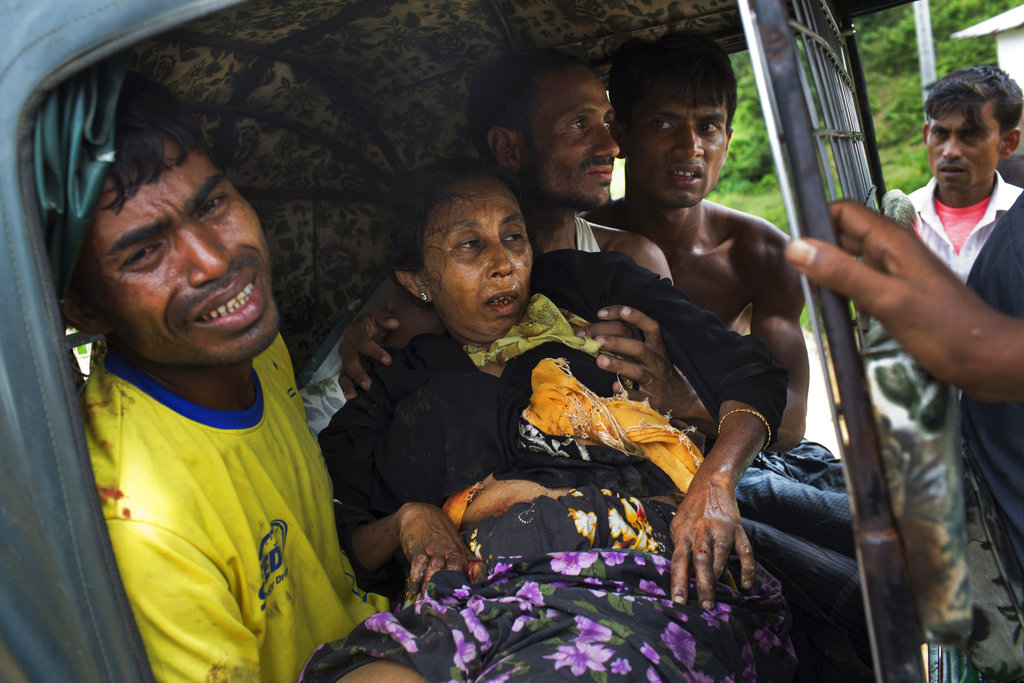 An elderly Rohingya woman injured by a landmine while crossing the border from Myanmar is rushed by relatives to a hospital near the border town of Kutupalong in Bangladesh in 2017. Myanmar’s military has been accused of planting landmines in the path of Rohingya Muslims fleeing violence in the country’s western Rakhine state