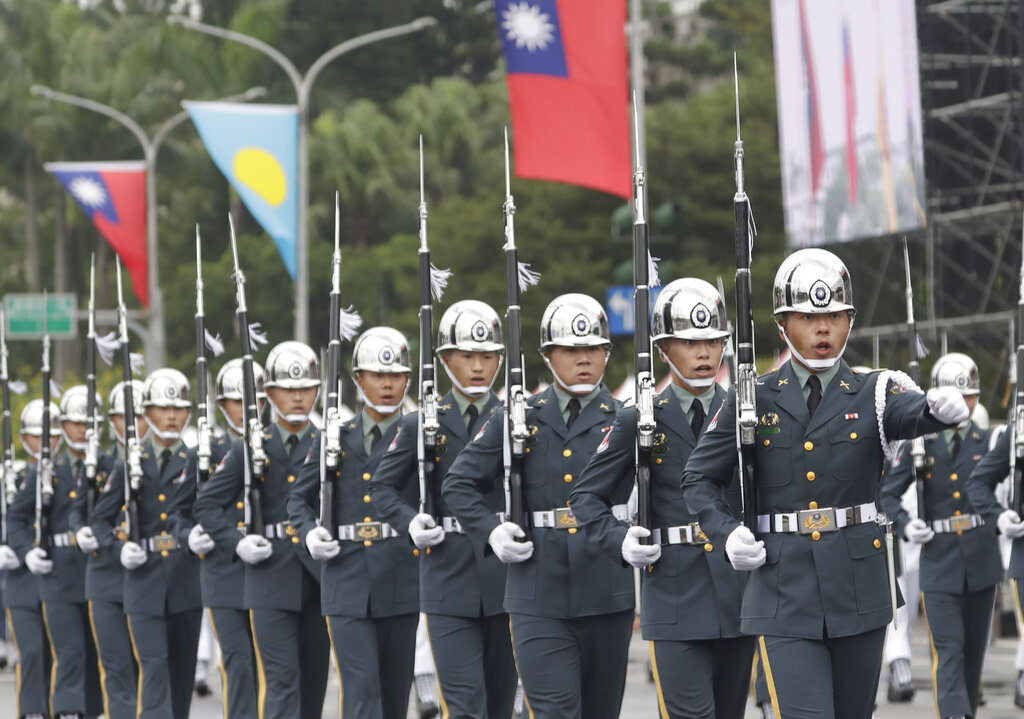 The military honor guard attend National Day celebrations in front of the Presidential Building in Taipei, Taiwan, Monday, Oct. 10, 2022. (AP Photo/Chiang Ying-ying)