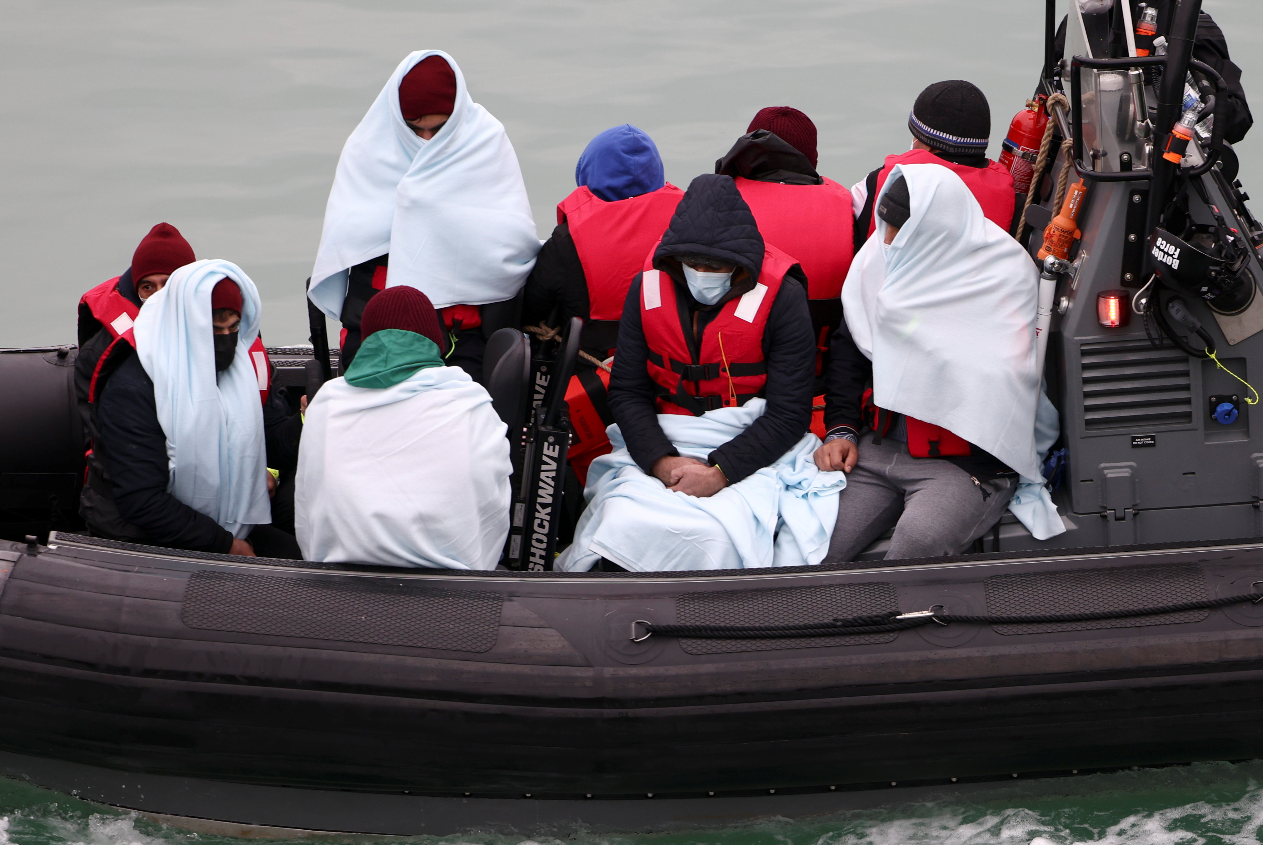People are brought into Dover harbour on board a Border Force vessel after crossing the channel