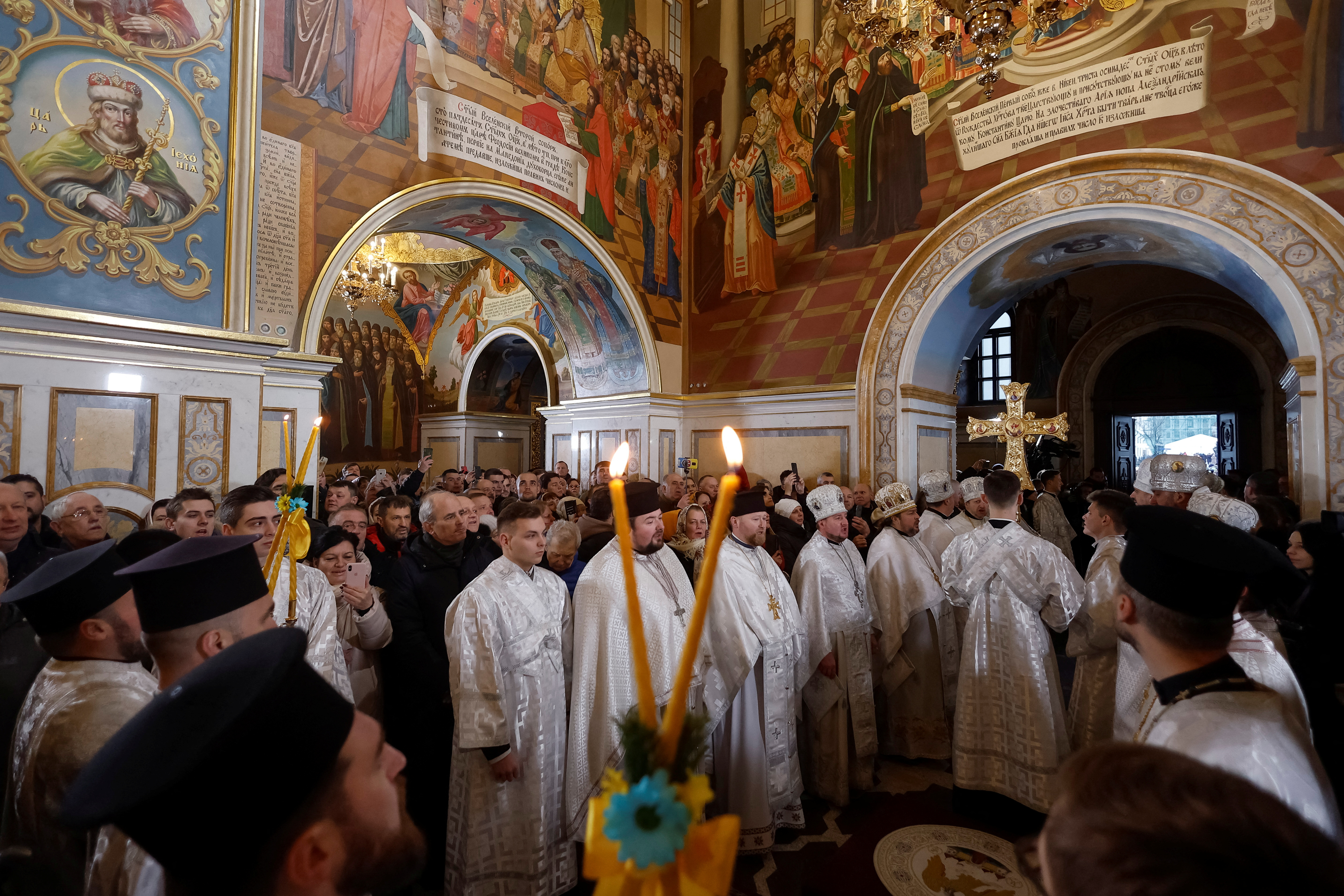 Orthodox priests of the Orthodox Church of Ukraine conduct a Christmas service inside Uspenskyi Cathedral in Kyiv