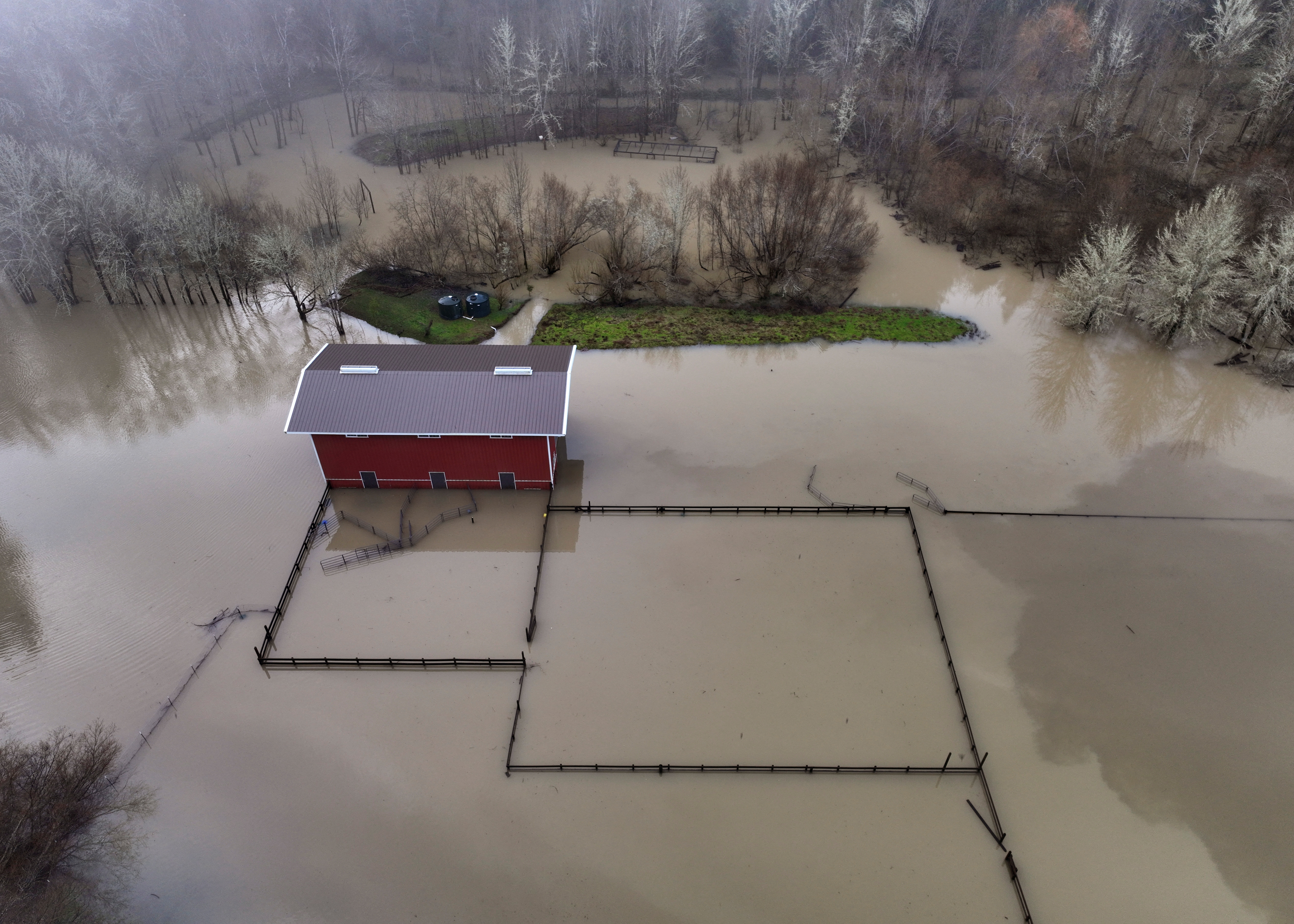 Floodwaters from the Russian River rise up around buildings in Guerneville, California, on January 15, 2023