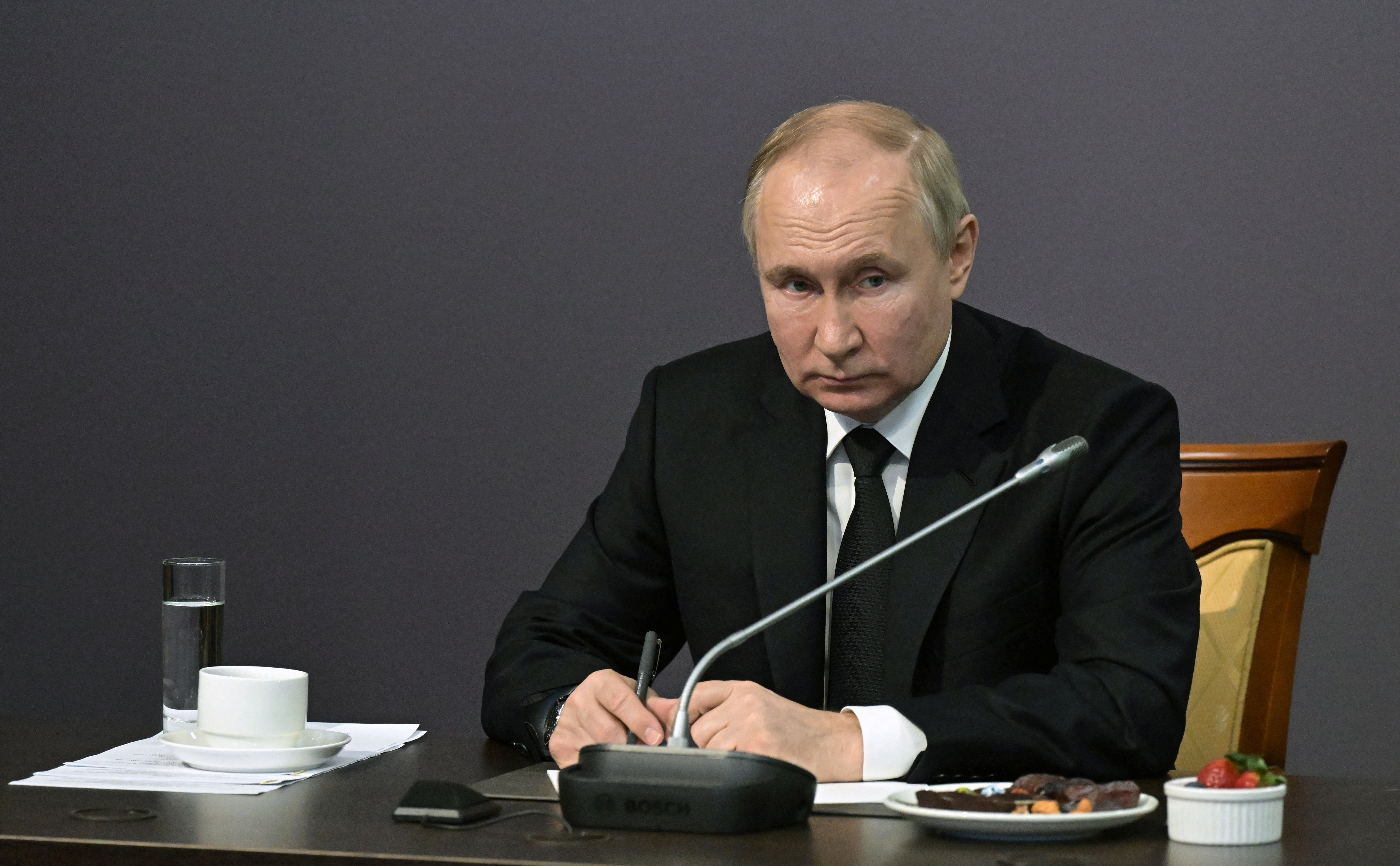 Russian President Vladimir Putin attends a meeting with local residents, veterans and representatives of civil society organizations to mark the 80th anniversary of a breakthrough in the siege of Leningrad during World War Two at the State Memorial Museum of the Defence and Siege of Leningrad in Saint Petersburg, Russia, January 18, 2023.