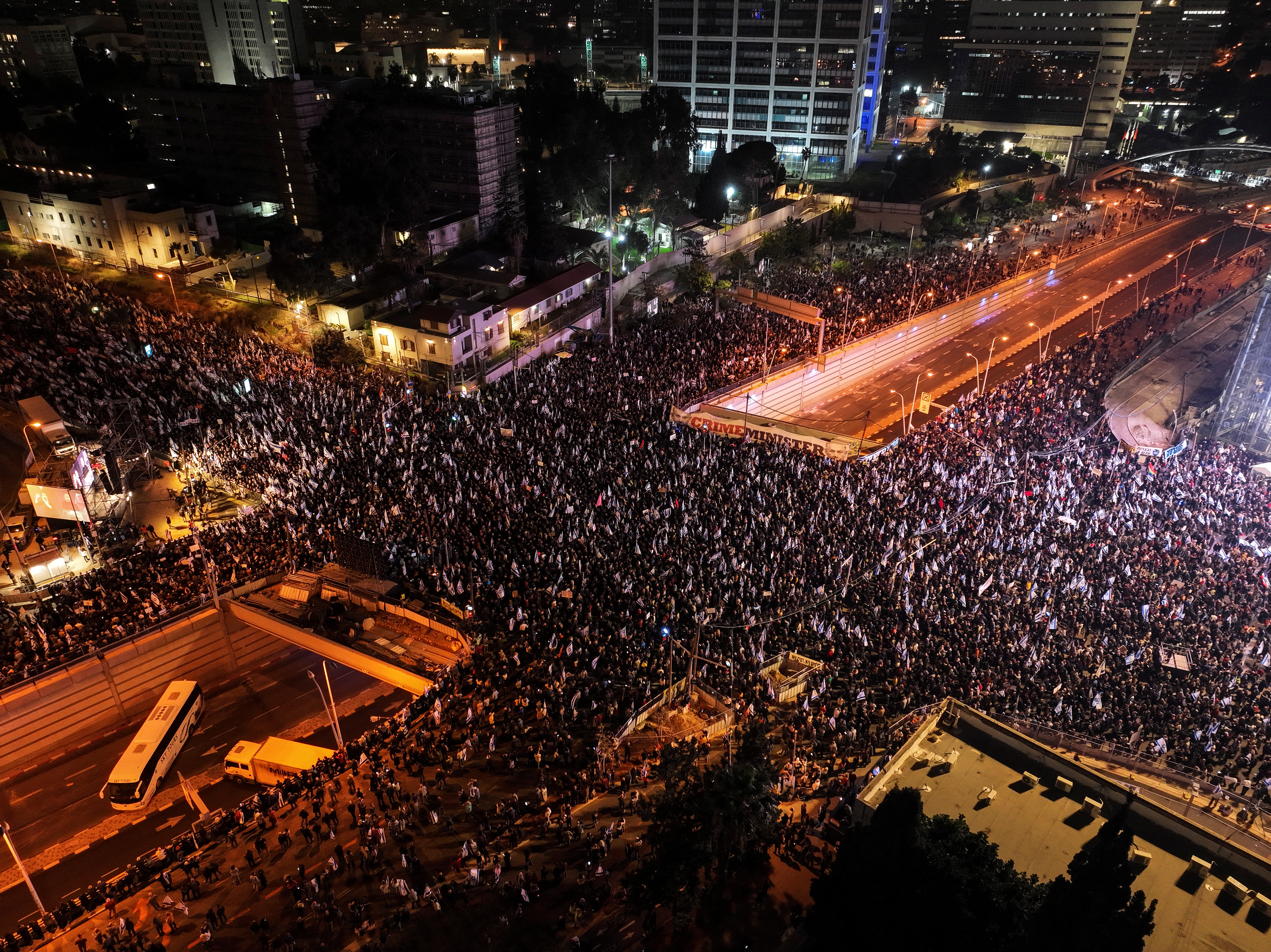An aerial view shows Israelis attending a demonstration against proposed changes to the judicial system by Israel’s new right-wing government, in Tel Aviv