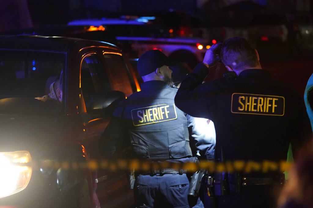 members of the sheriff's department at the crime scene