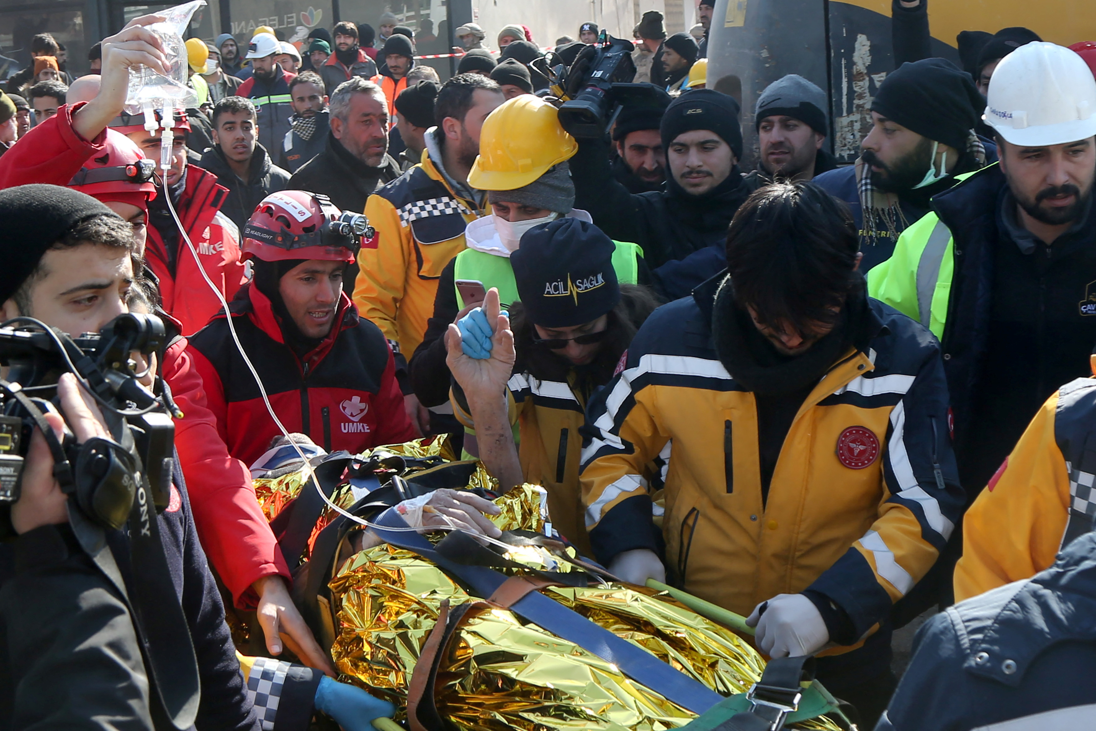 Kazim Kaya, a 60-year-old man, is carried by rescuers, after survived a deadly earthquake in Adiyaman, Turkey February 11, 2023.