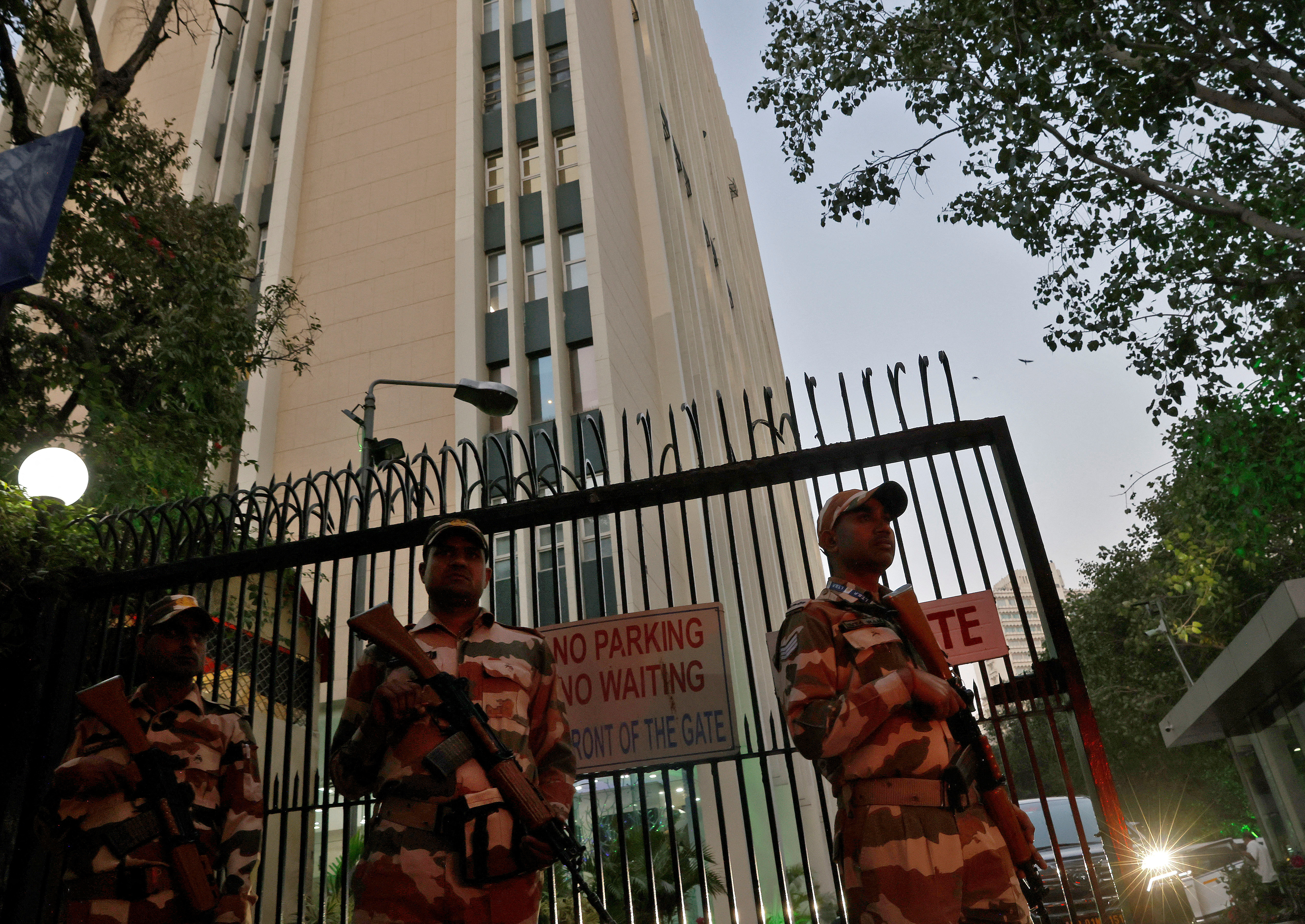 Members of the Indo-Tibetan Border Police (ITBP) stand guard outside a building housing BBC offices, where income tax officials are conducting a search for a second day, in New Delhi, India, February 15, 2023. REUTERS/Altaf Hussain