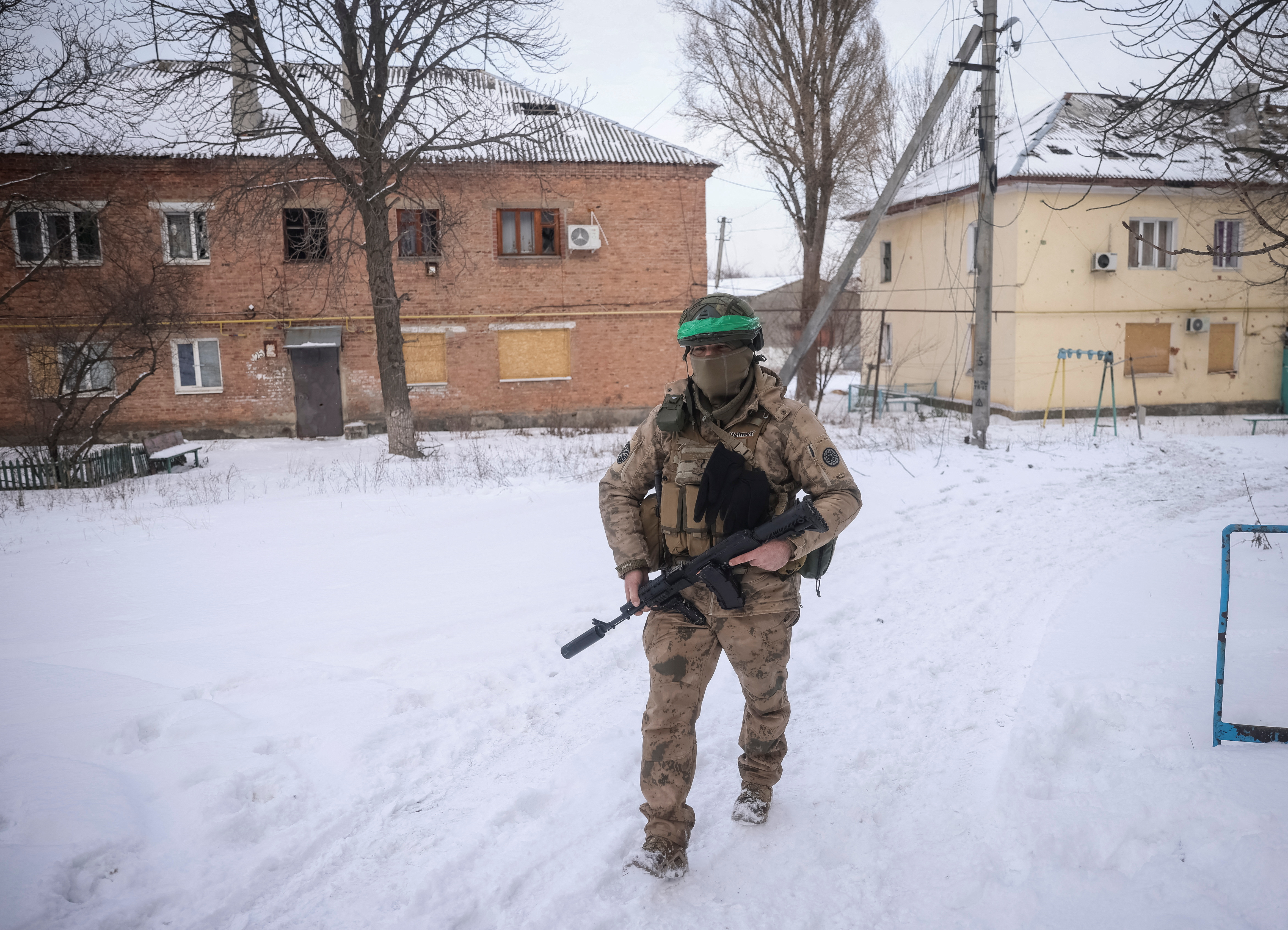 A Ukrainian serviceman walks on an empty street, as Russia's attack on Ukraine continues, in the front line city of Bakhmut, Ukraine