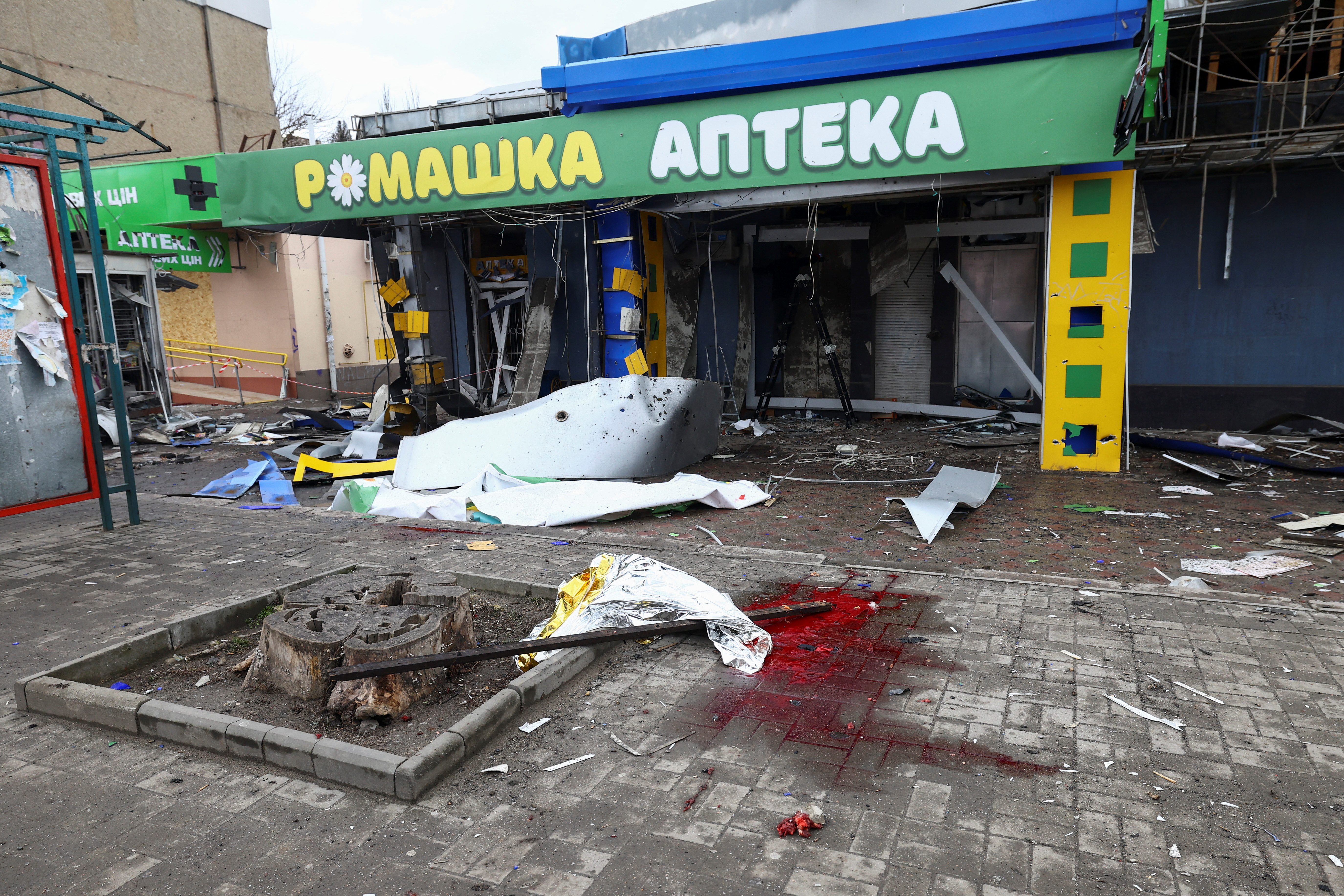 A puddle of blood is seen on the ground at a bus station damaged after a shelling, amid Russia's attack on Ukraine, in Kherson, Ukraine February 21, 2023. REUTERS/Lisi Niesner