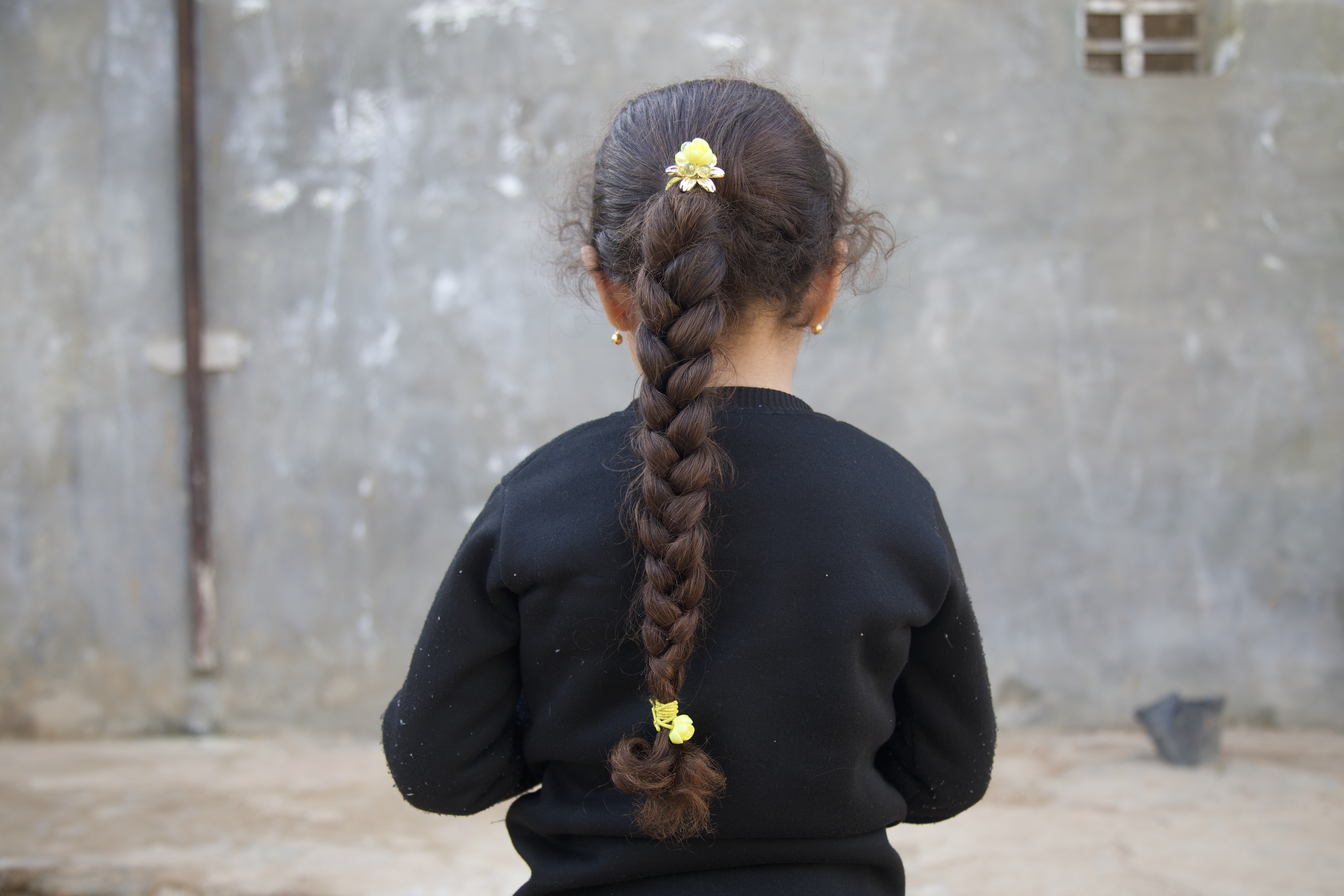 Maryam al-Sayed’s father recognised her by her long hair while they were buried in darkness under the rubble
