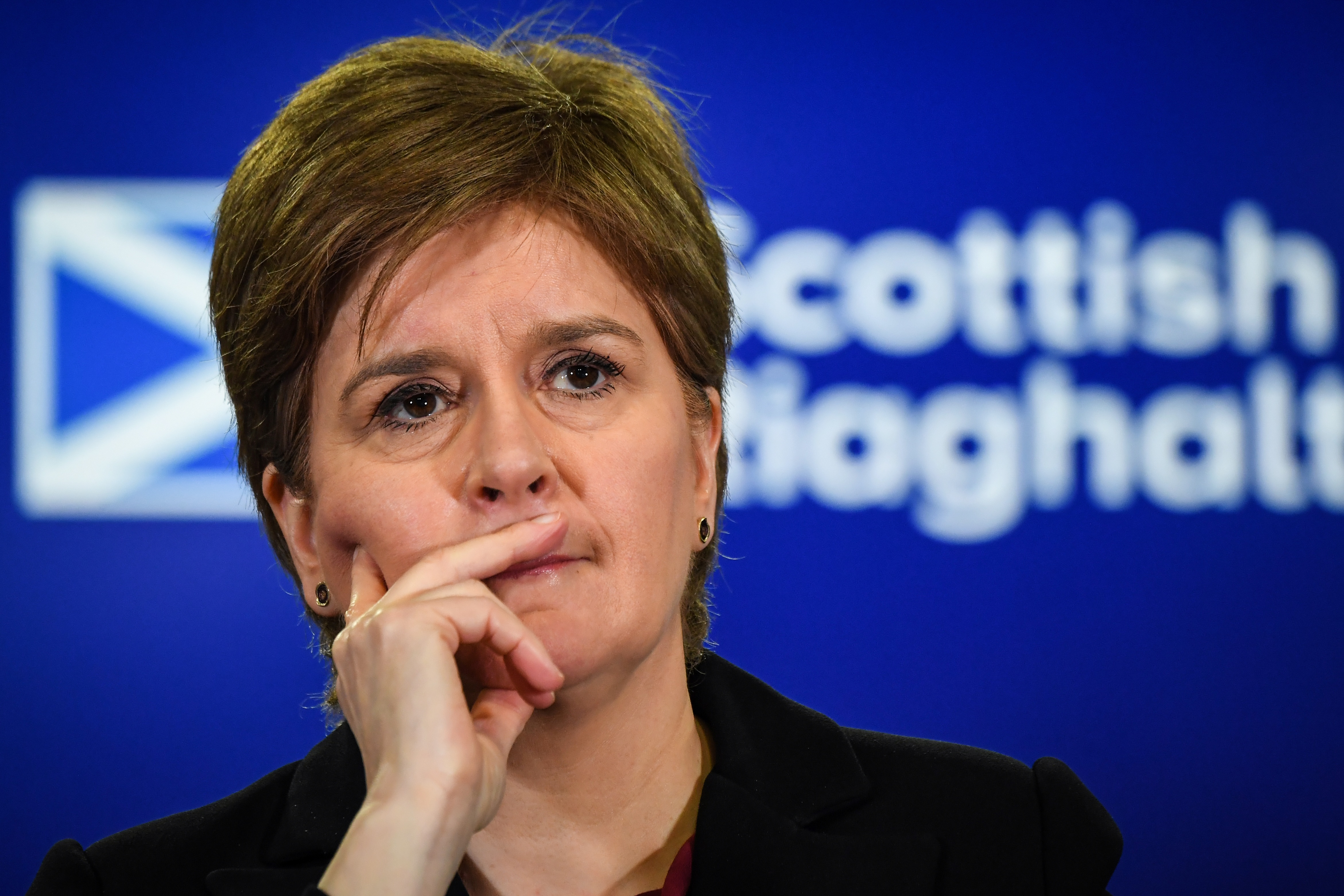 Sturgeon interacts with journalists during a news conference at St Andrews House, Edinburgh, Scotland