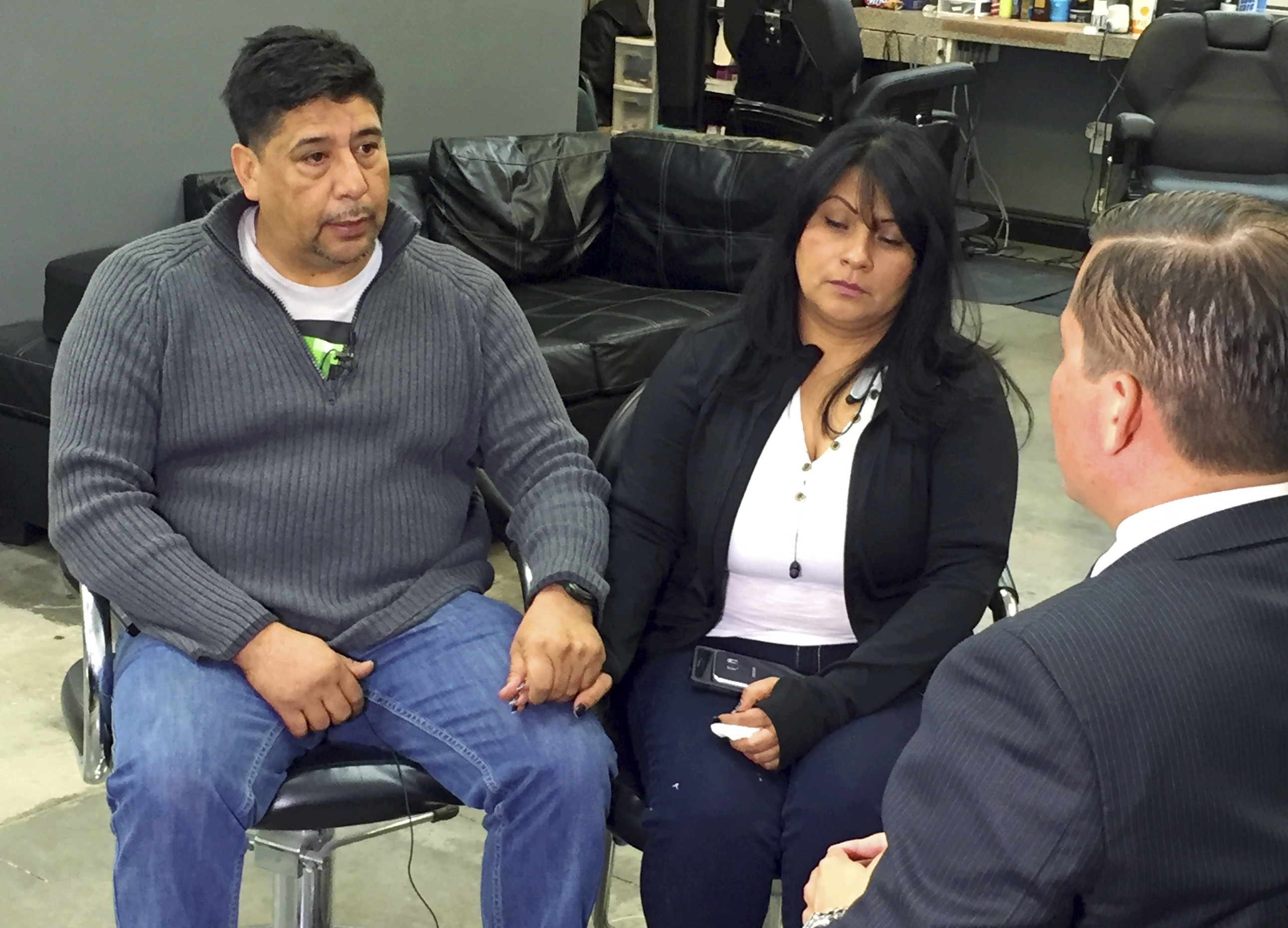 Jose Hernandez holds hands with Beatriz Gonzalez during an interview in California