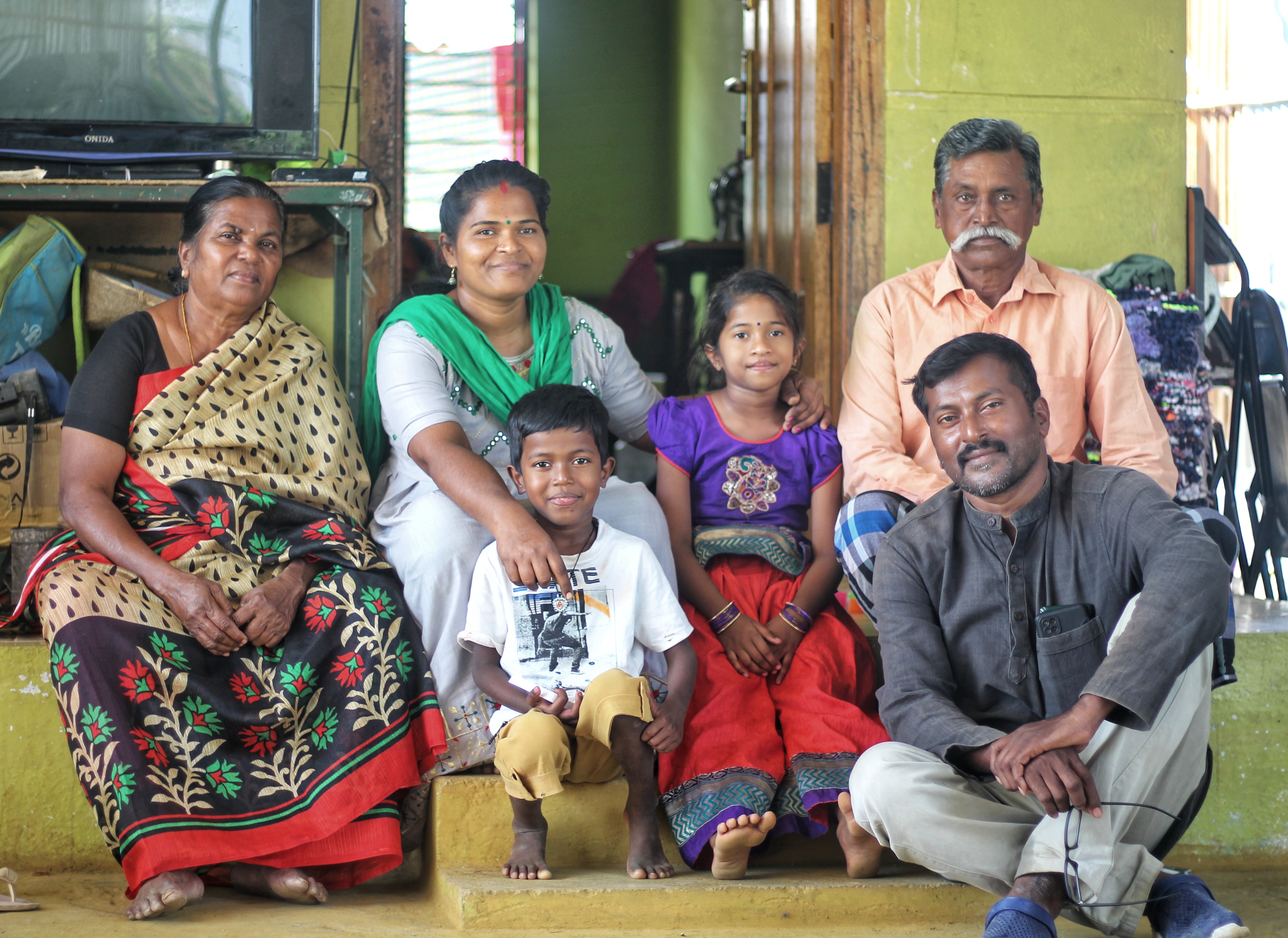 A photo of the Anbu family which consists of six people.