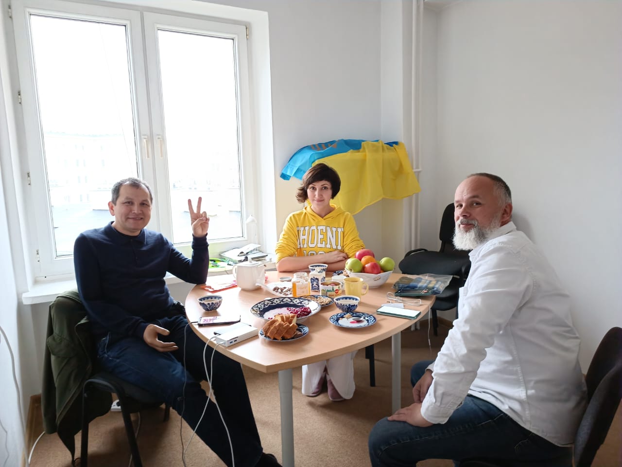 Zakhida with her brother Erfan (left) and a friend in her Warsaw flat [Courtesy of Zakhida Adylova]