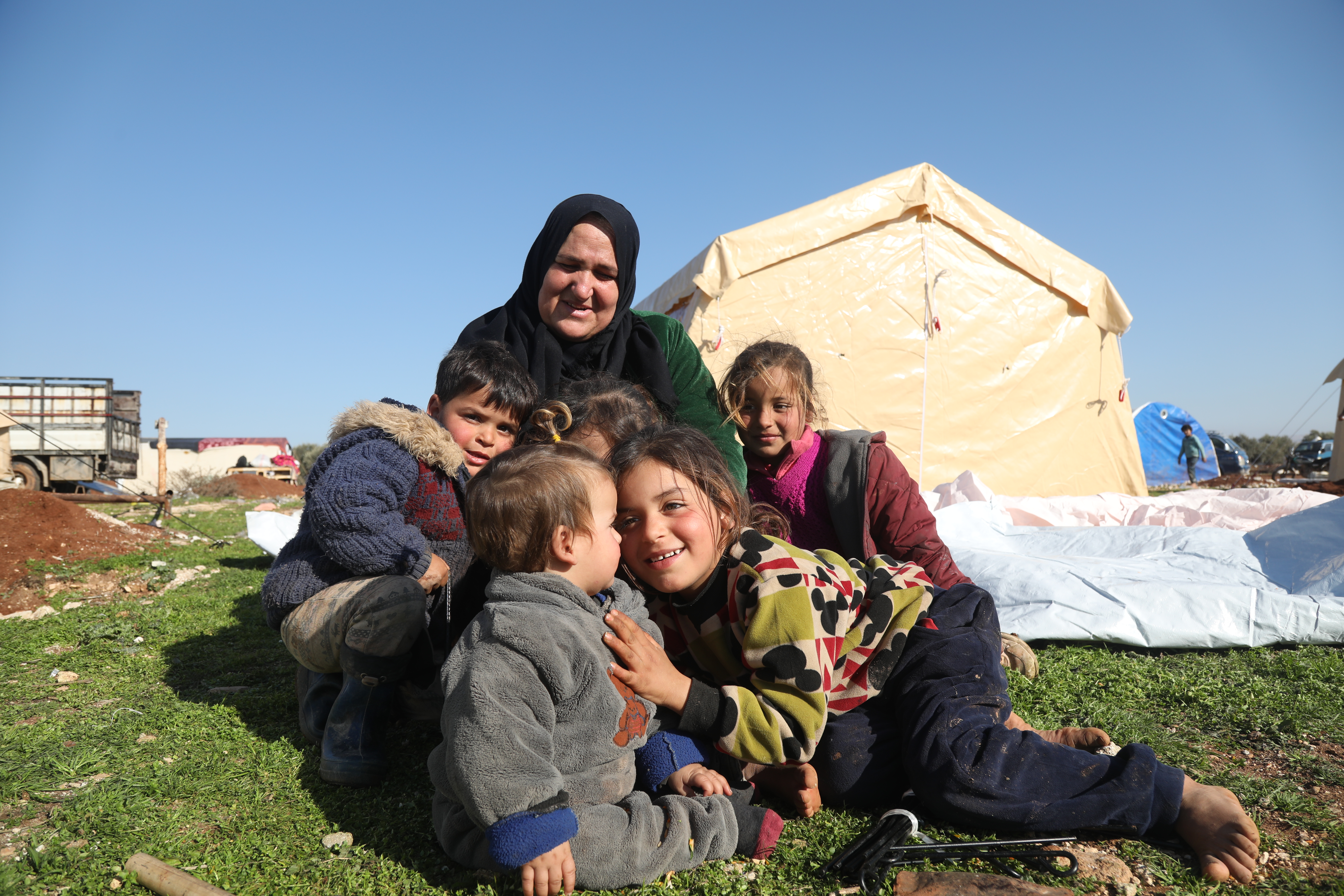 Samaher Rashid tries to spend the day playing with her children to distract them from the disaster