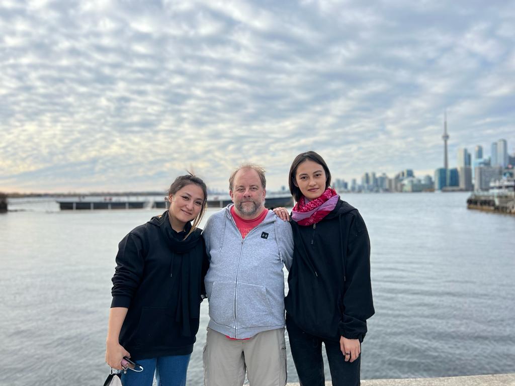 Aqila’s daughter Tamanna Sharifi, right, with sponsor Brennan Leffler and Mahnaz Aliyar, in Toronto in November 2022 [Courtesy of Brennan Leffler]