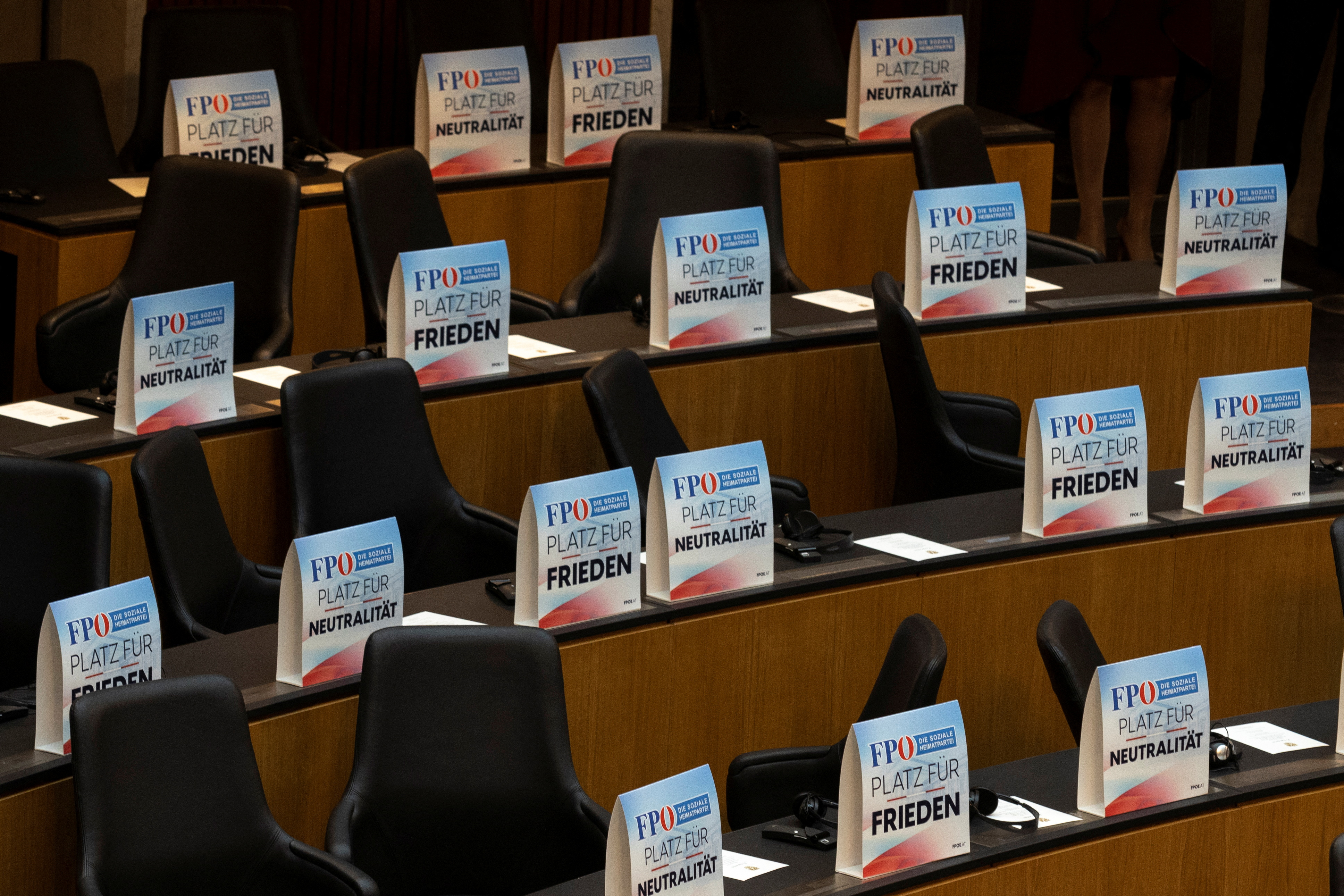 Ukrainian President Volodymyr Zelenskiy addresses Austria's lower house of parliament by video link, while members of the Parliament from the Freedom Party leave the plenary hall, in Vienna, Austria, March 30, 2023. REUTERS/Lisa Leutner