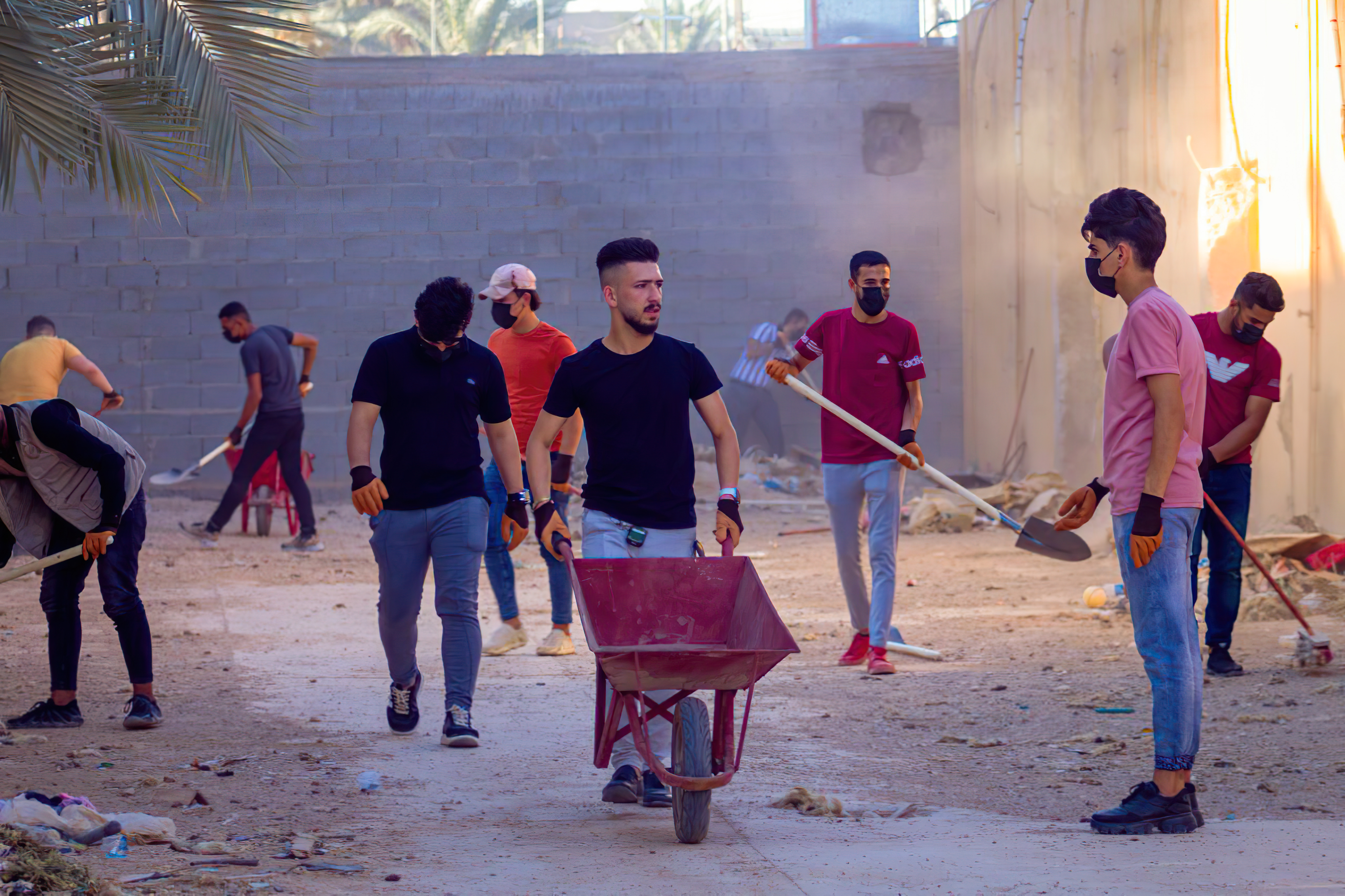 Laith works with his volunteer team to clean up public areas in Al-Qaim. Laith has little faith in the government, he believes that civil society organisations are crucial for addressing community needs [Courtesy of Laith Louay]