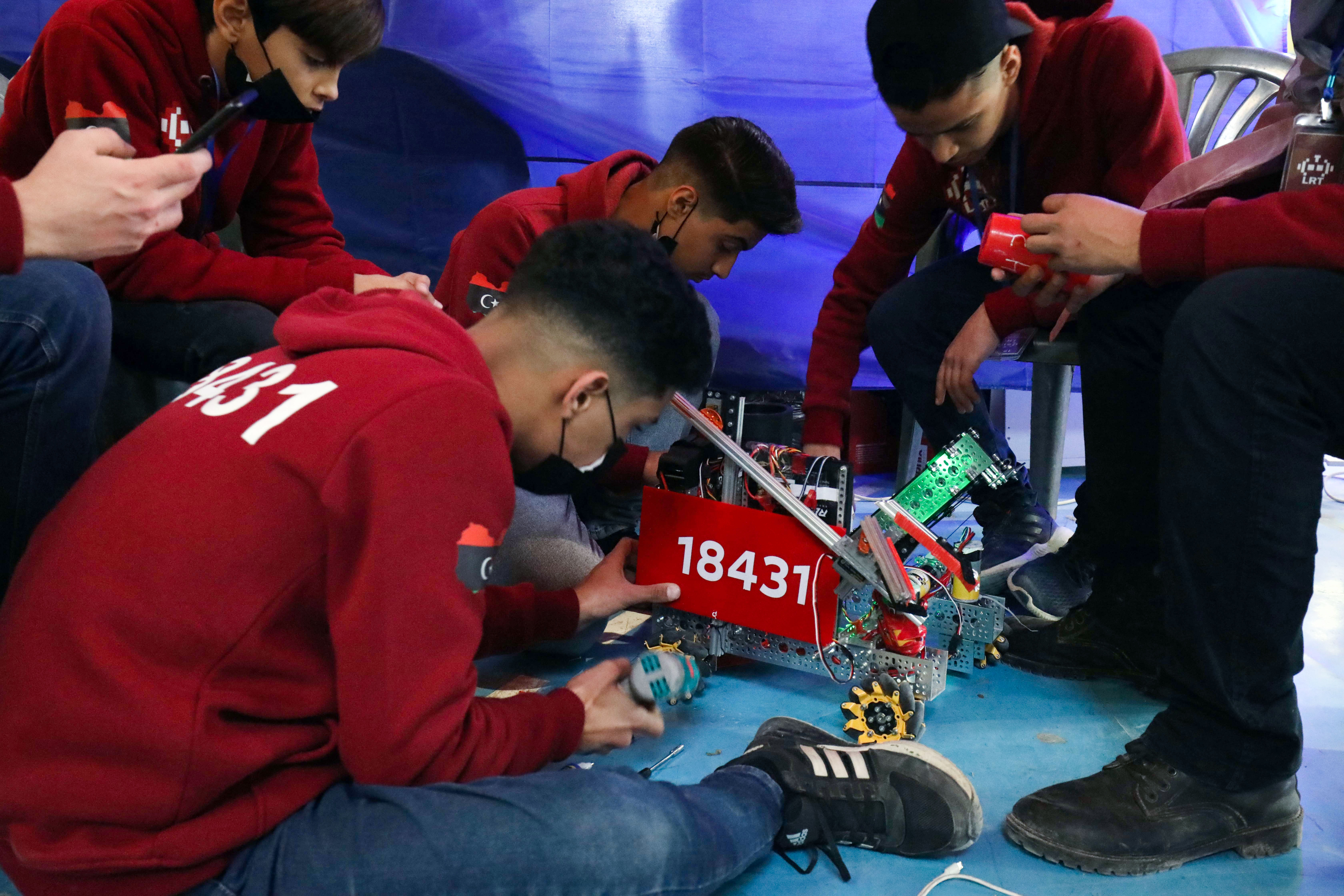 Libyan youths take part in the yearly First Tech Challenge, a country-wide robotics competition, as regional qualifiers for Libya begin in the eastern city of Benghazi, on February 3, 2022