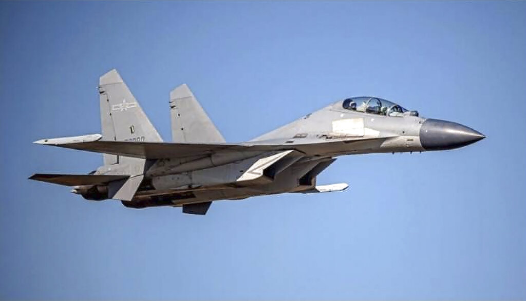 FILE - In this undated file photo released by the Taiwan Ministry of Defense, a Chinese PLA J-16 fighter jet flies in an undisclosed location. China’s military sent 71 planes, including J16 fighter jets, and seven ships toward Taiwan in a 24-hour display of force directed at the island, Taiwan’s defense ministry said Monday, Dec. 26, 2022, after China expressed anger at Taiwan-related provisions in a U.S. annual defense spending bill passed on Saturday.(Taiwan Ministry of Defense via AP, File)