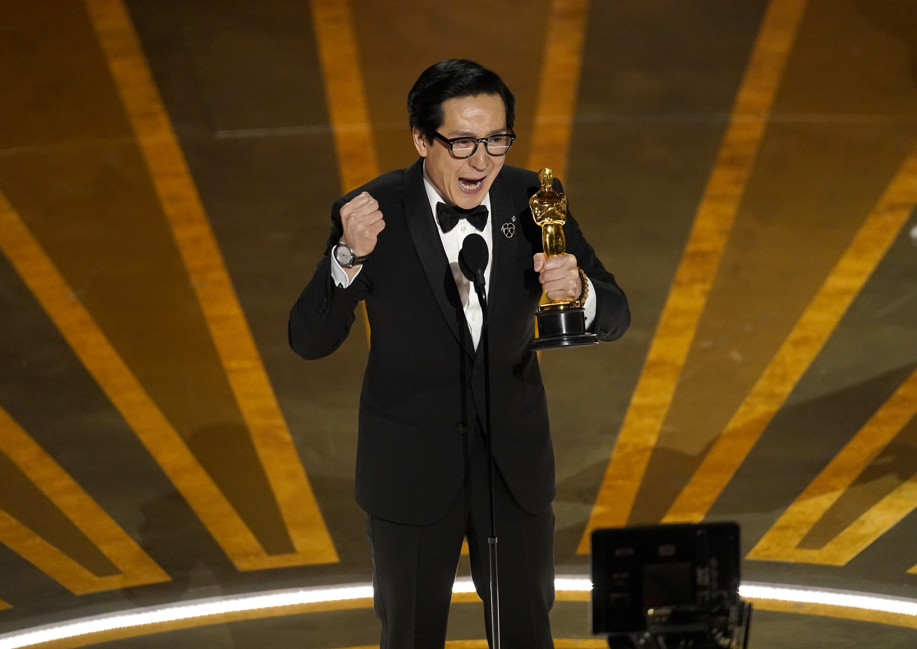 Ke Huy Quan accepts the award for best supporting actor for Everything Everywhere All at Once