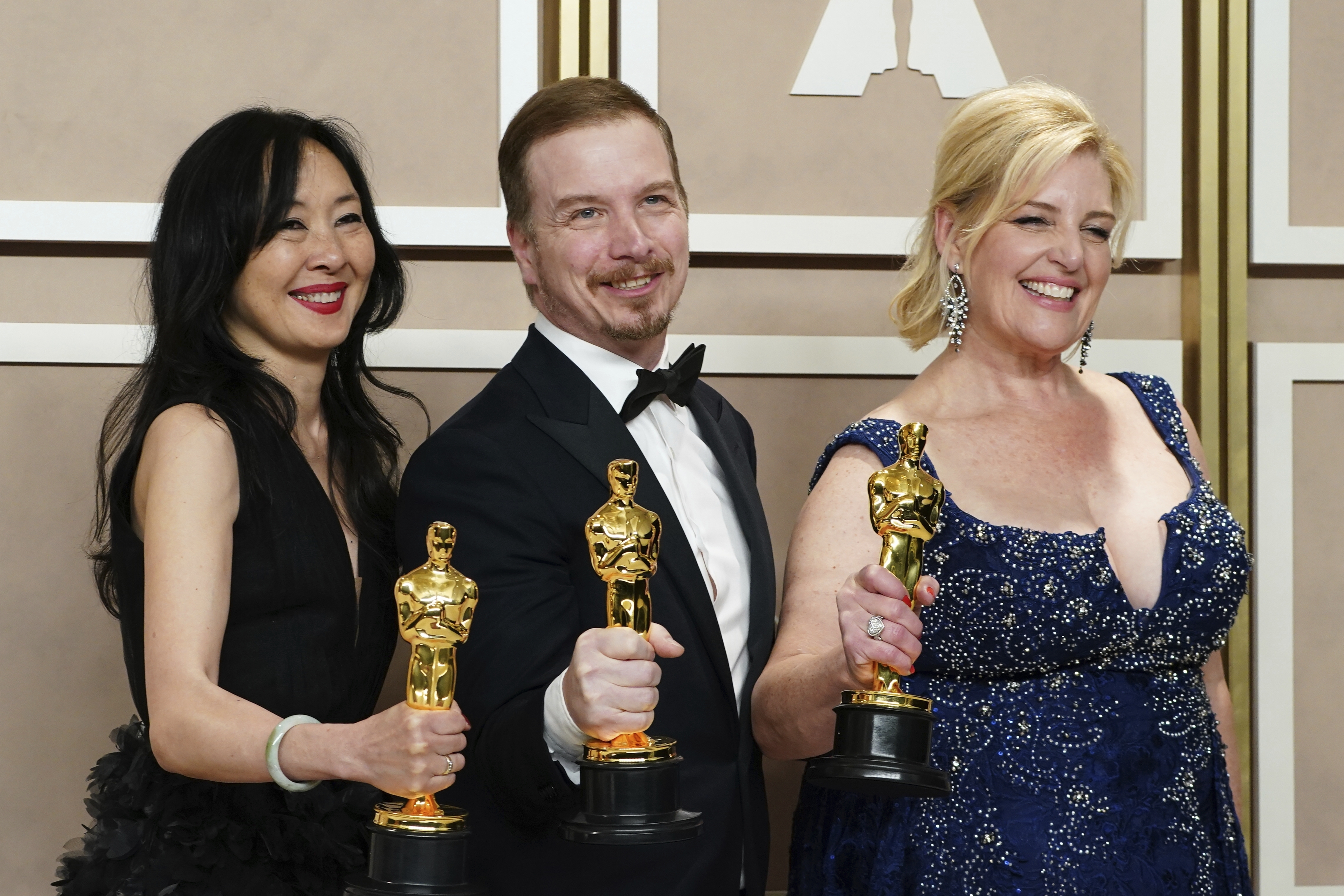 Judy Chin (from left), Adrien Morot and Annemarie Bradley pose with their awards for best makeup and hairstyling for The Whale