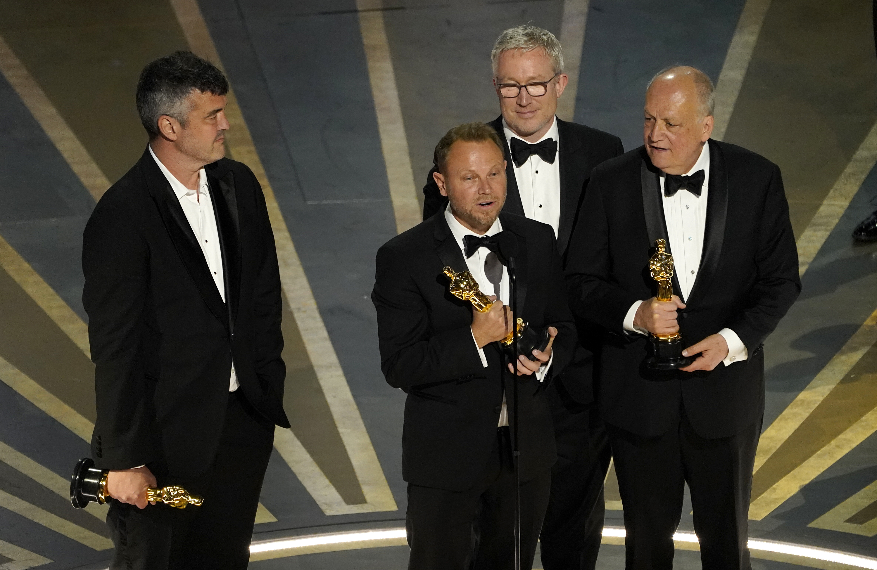 Eric Saindon (from left), Richard Baneham, Daniel Barrett and Joe Letteri accept the only Oscar for Avatar: The Way of Water