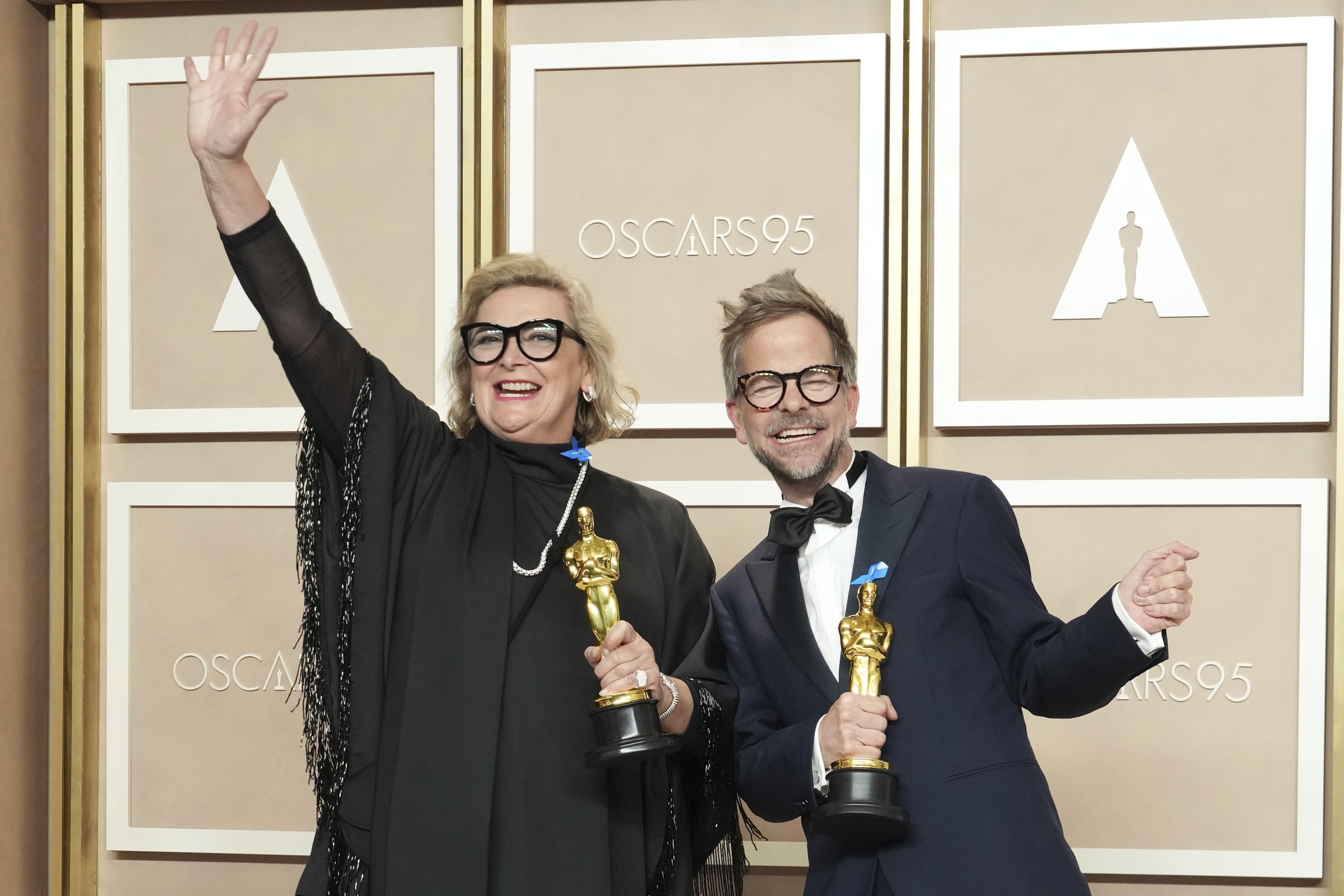 Ernestine Hipper, left, and Christian Goldbeck celebrate a production design win for All Quiet on the Western Front