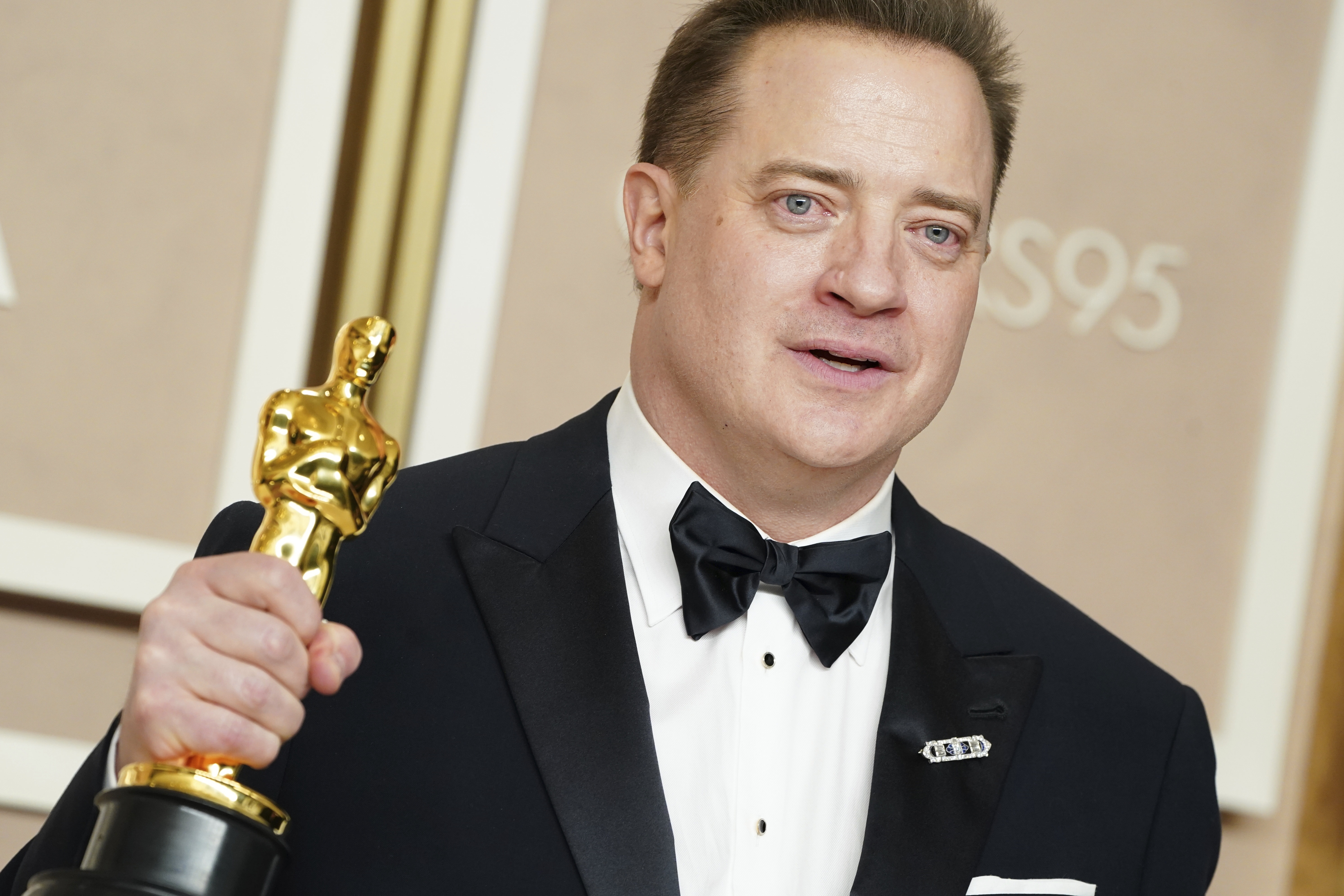 Brendan Fraser poses with the award for the best actor