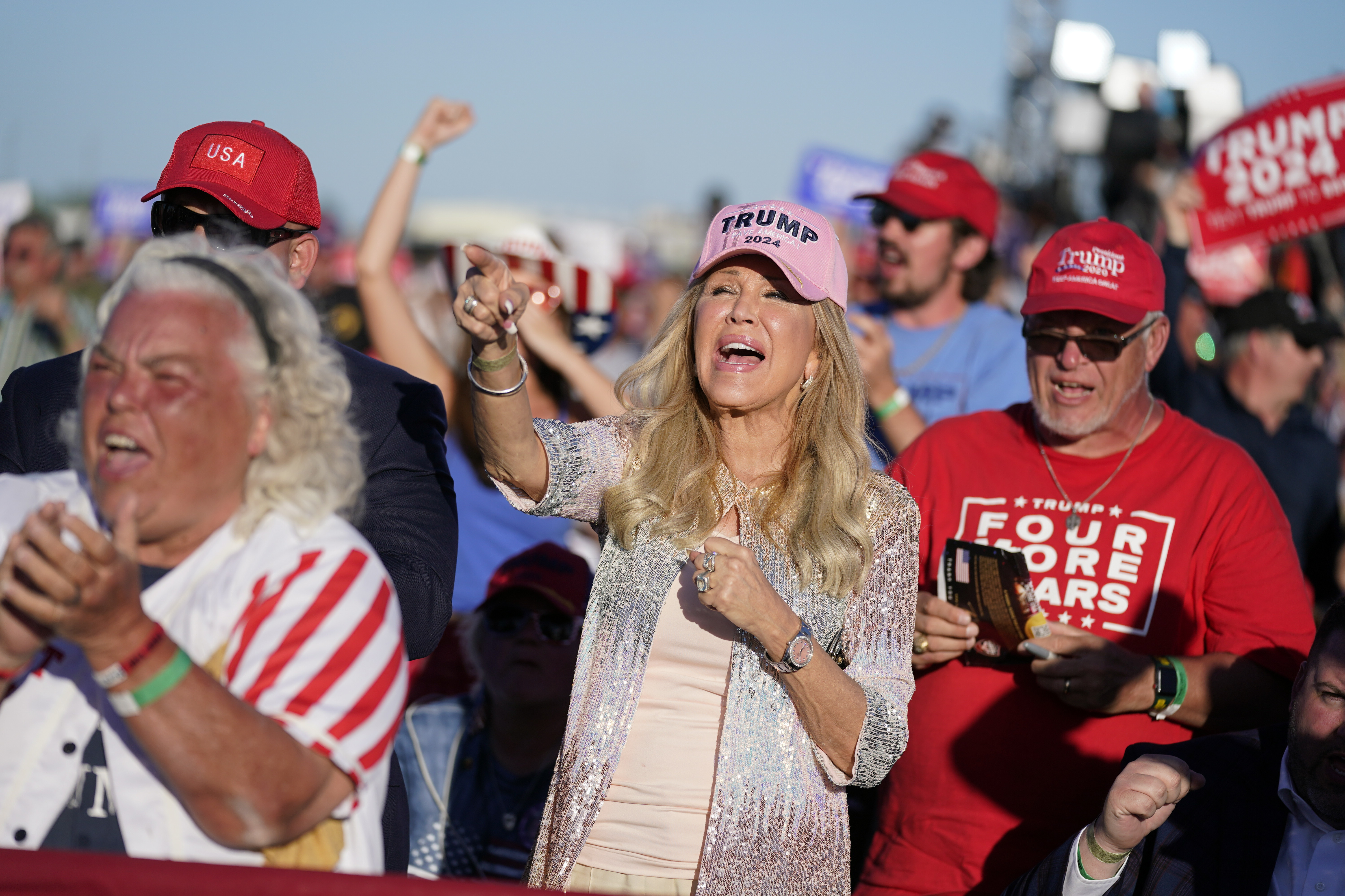 Supporters of former President Donald Trump cheer as he speaks at a campaign rally at Waco Regional Airport, Saturday, March 25, 2023, in Waco, Texas