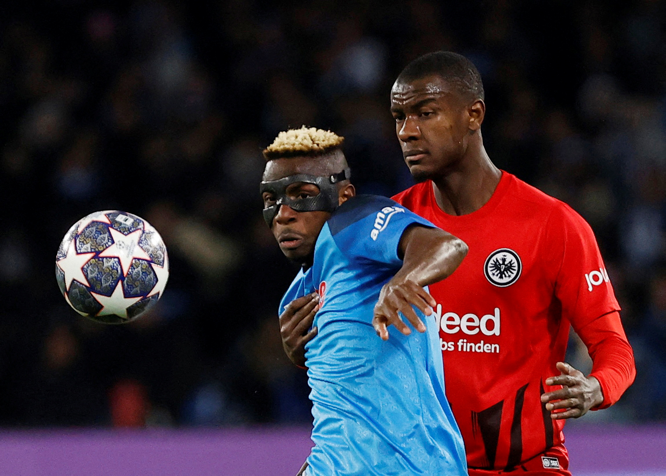 Osimhen, left, in action with Eintracht Frankfurt’s Obite Ndicka at the Stadio Diego Armando Maradona in Naples