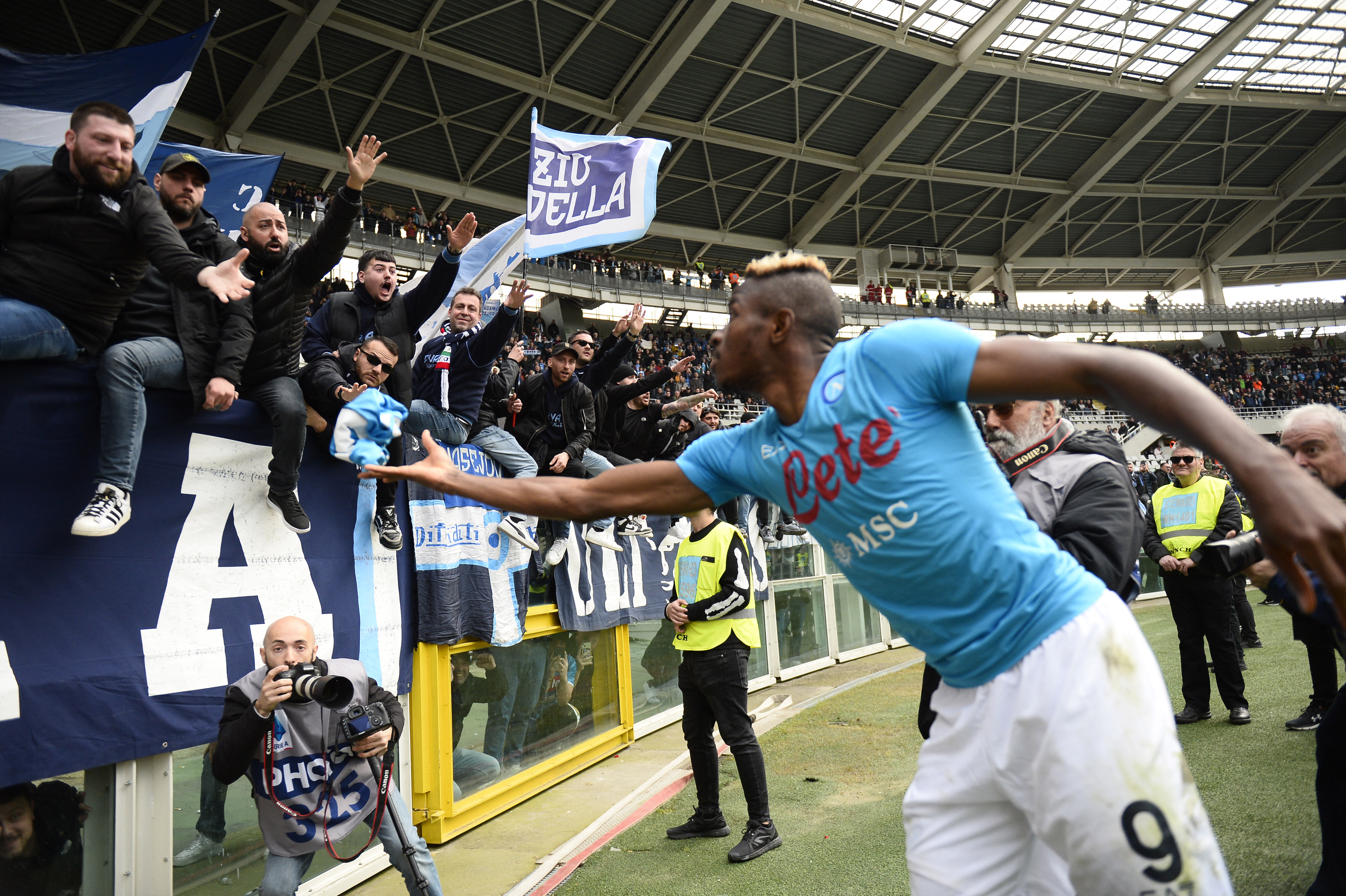 Osimhen celebrates with Napoli fans after a match in Turin