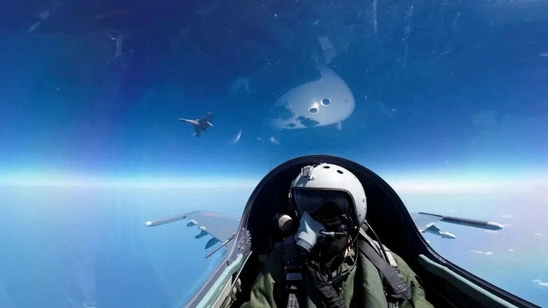 Chinese pilot operates an aircraft of the People's Liberation Army