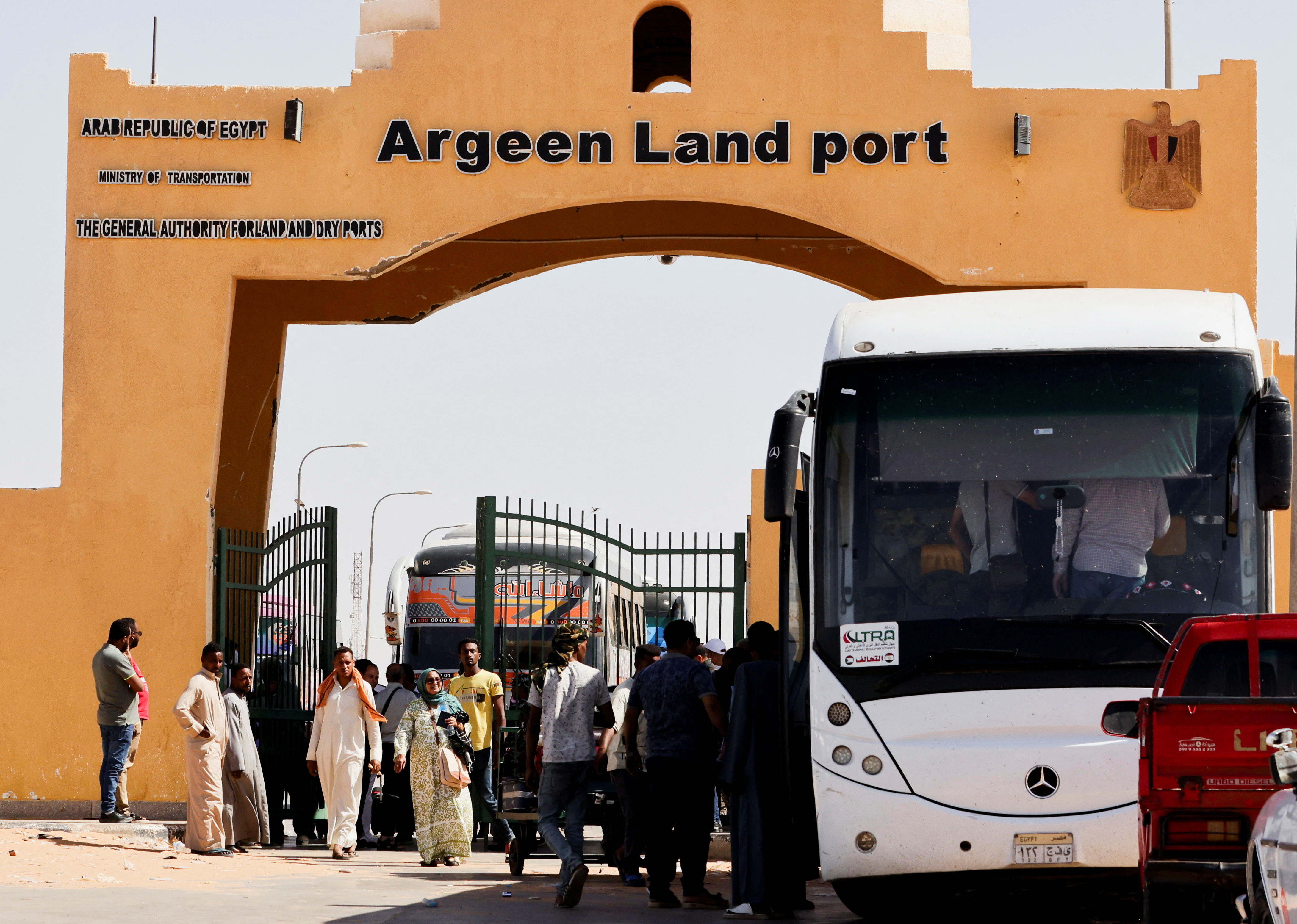 Passengers fleeing from Sudan arrive at the Argeen land port, after being evacuated from Khartoum to Abu Simbel city, at the upper reaches of the Nile in Aswan